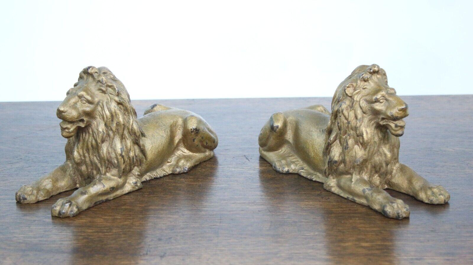 Metal A Pair of Antique Late 19th Century Recumbent Cast Lions For Sale