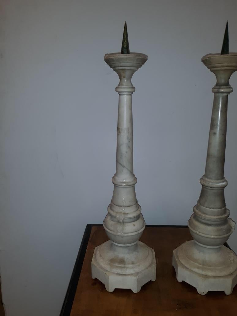 A pair of solid white marble antique Italian pricket candlesticks, last quarter 19th Century 21.5 inches tall including the top spike.