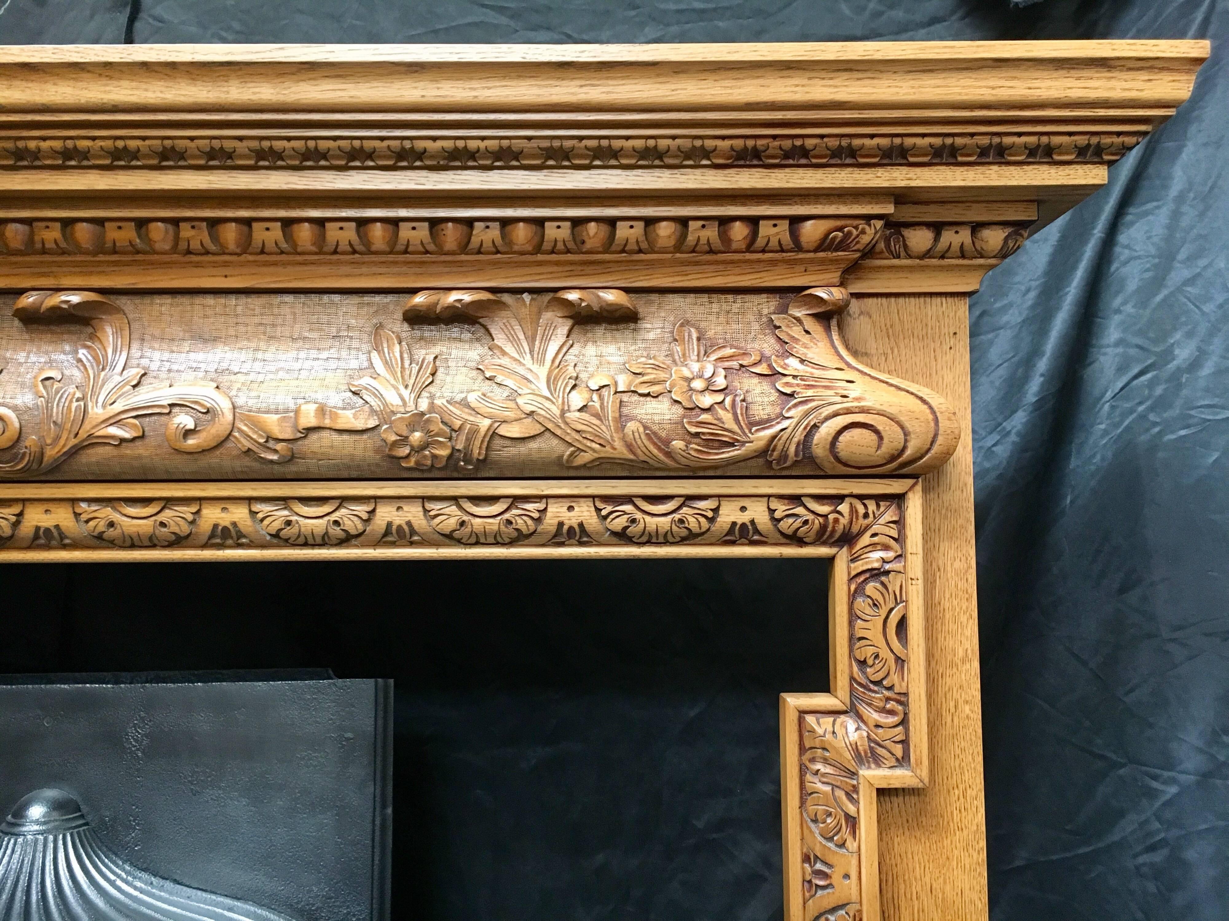 Early 20th Century Pair of Antique Oak Georgian Style Carved Wood Fireplace Surrounds