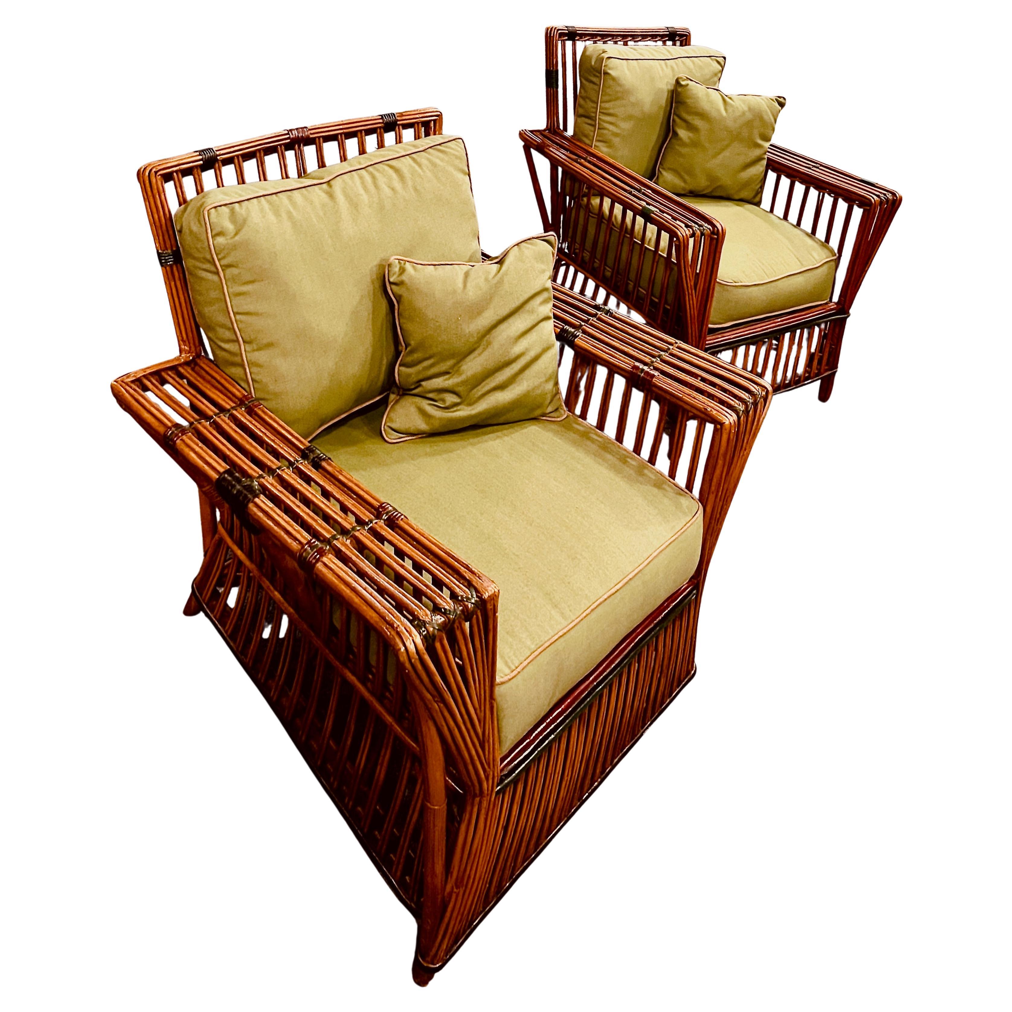 A complimentary pair of rattan arm chairs in natural finish with colored trimming, American,C.1920s.
This style of furniture was incredibly popular in the 1920s into the 1930s and referred to as stick wicker, a very stylish and simple contemporary