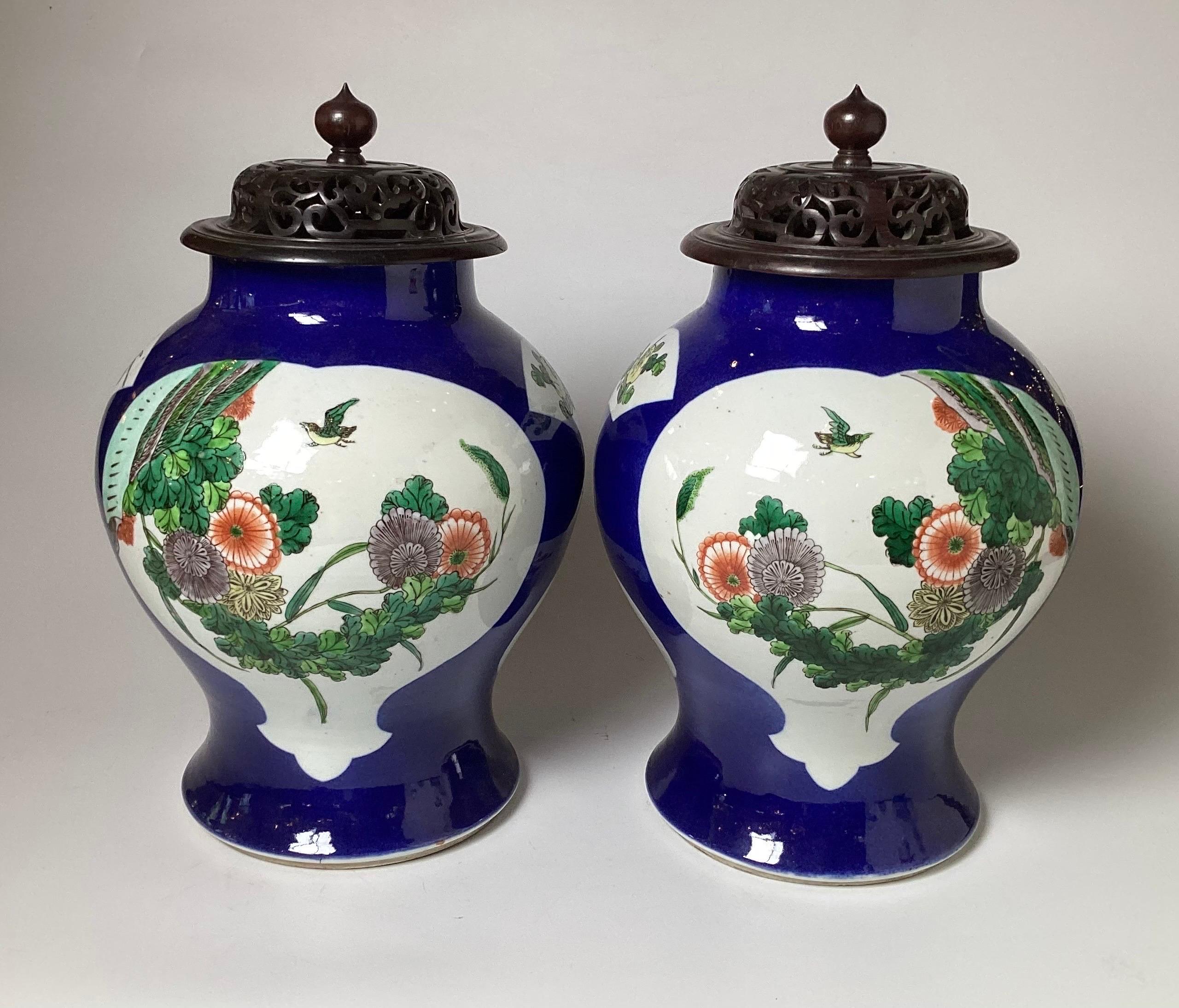 Hand-Painted A Pair of Antique Vibrant Blue Chines Porcelain Jars with Wood Lids For Sale