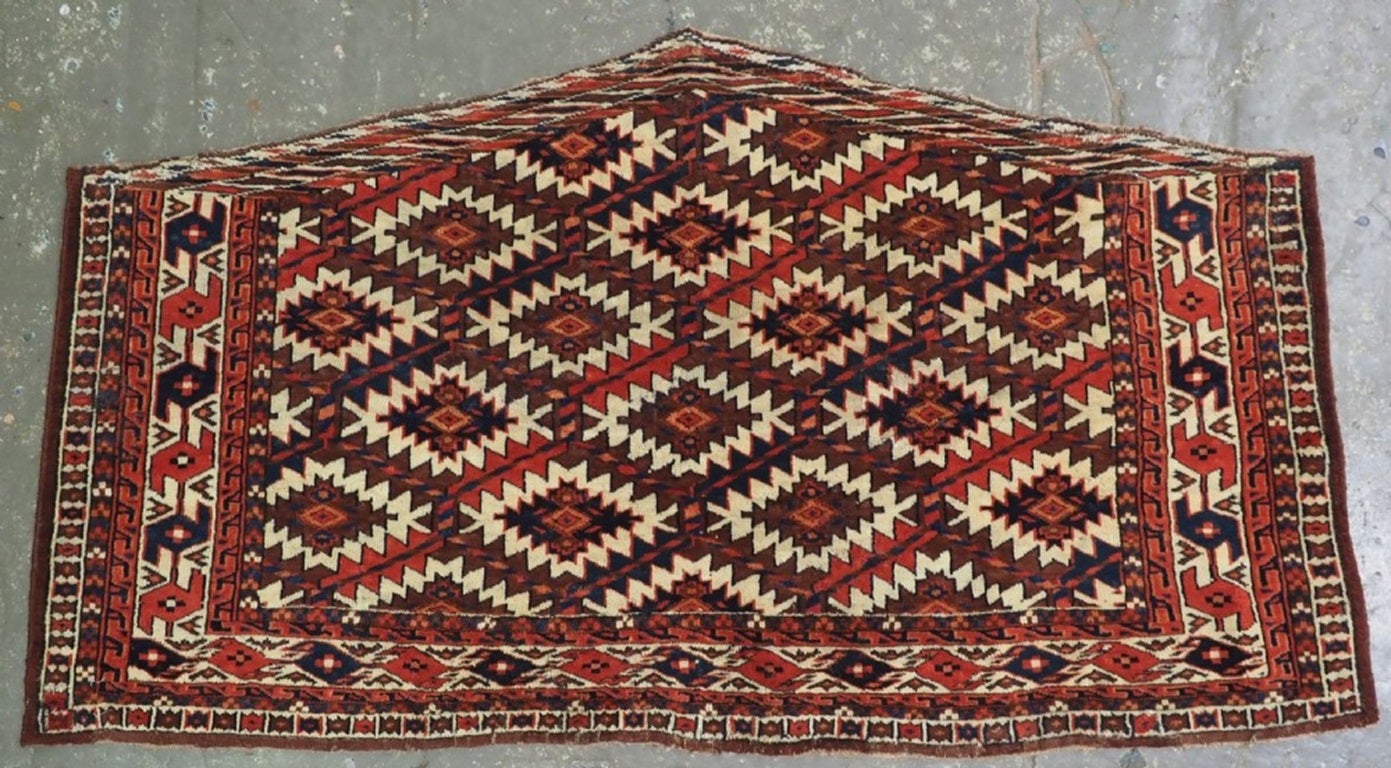 A good pair of antique Yomut Turkmen asmalyk with lattice design
2nd half 19th century

This pair are a good example of a Yomut Turkmen asmalyk, they have an ivory ground with a lattice design which contains the erre gul The ivory ground border is