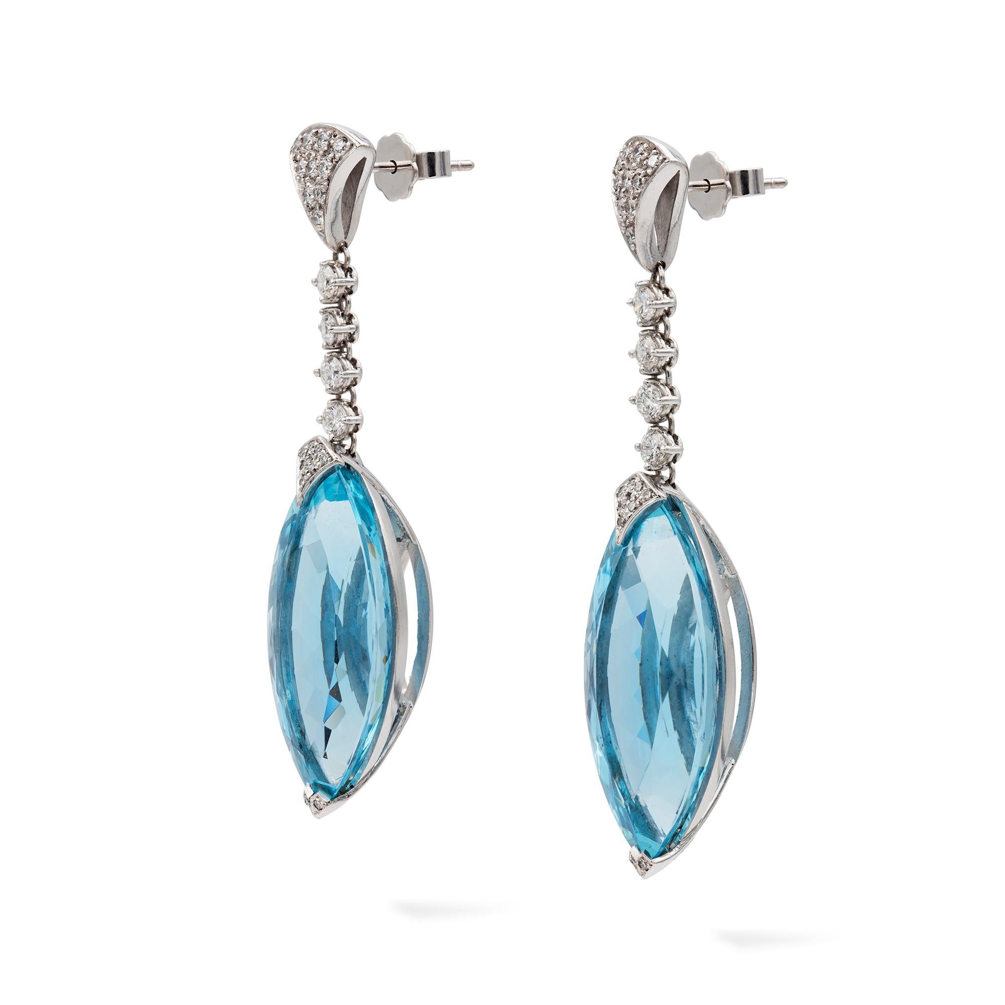 A pair of aquamarine and diamond drop earrings, each earring with a triangular shaped top encrusted with small round brilliant-cut diamonds, suspending a run consisting of four round-brilliant-cut diamonds, terminating to a marquise-cut aquamarine,
