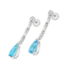 A pair of aquamarine and diamond drop earrings