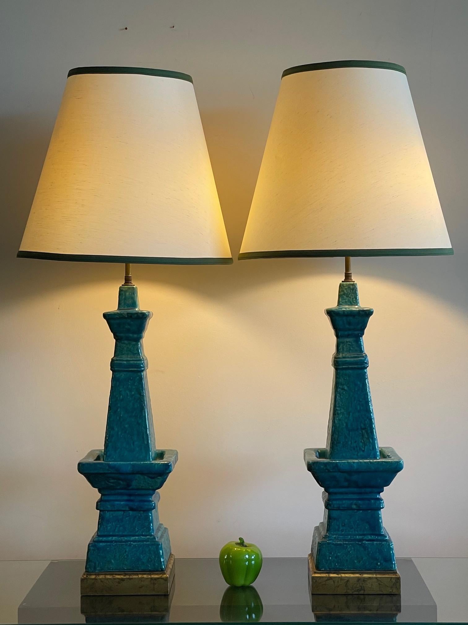 A pair of impressive Bittosi lamps in turquoise crackle and lava ceramic. Very stately and architectural these lamps measure 39.5