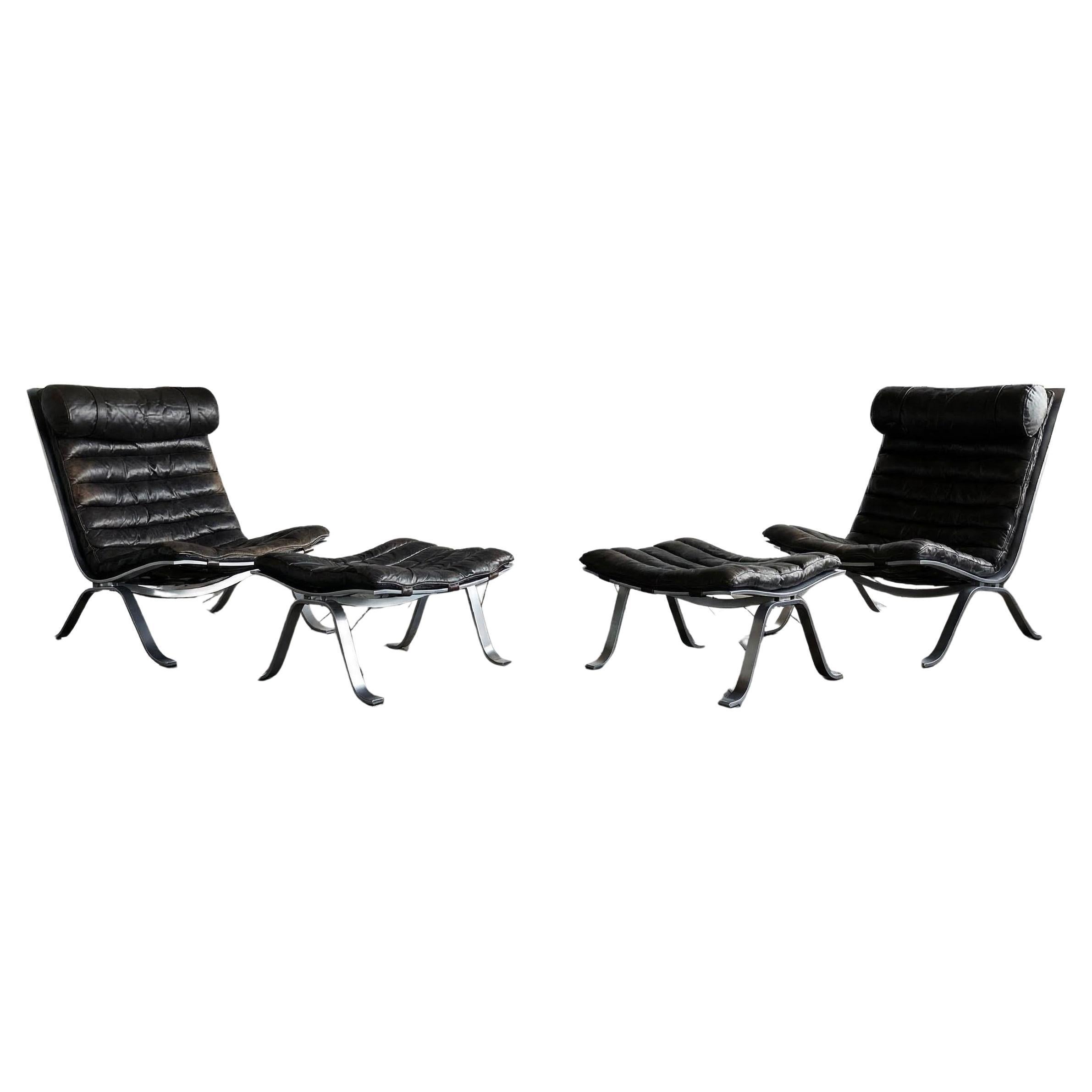 A pair of Ari Lounge chairs with ottomans by Arne Norell For Sale