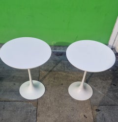 A pair. of. Arkana tulip tables by Maurice Burke