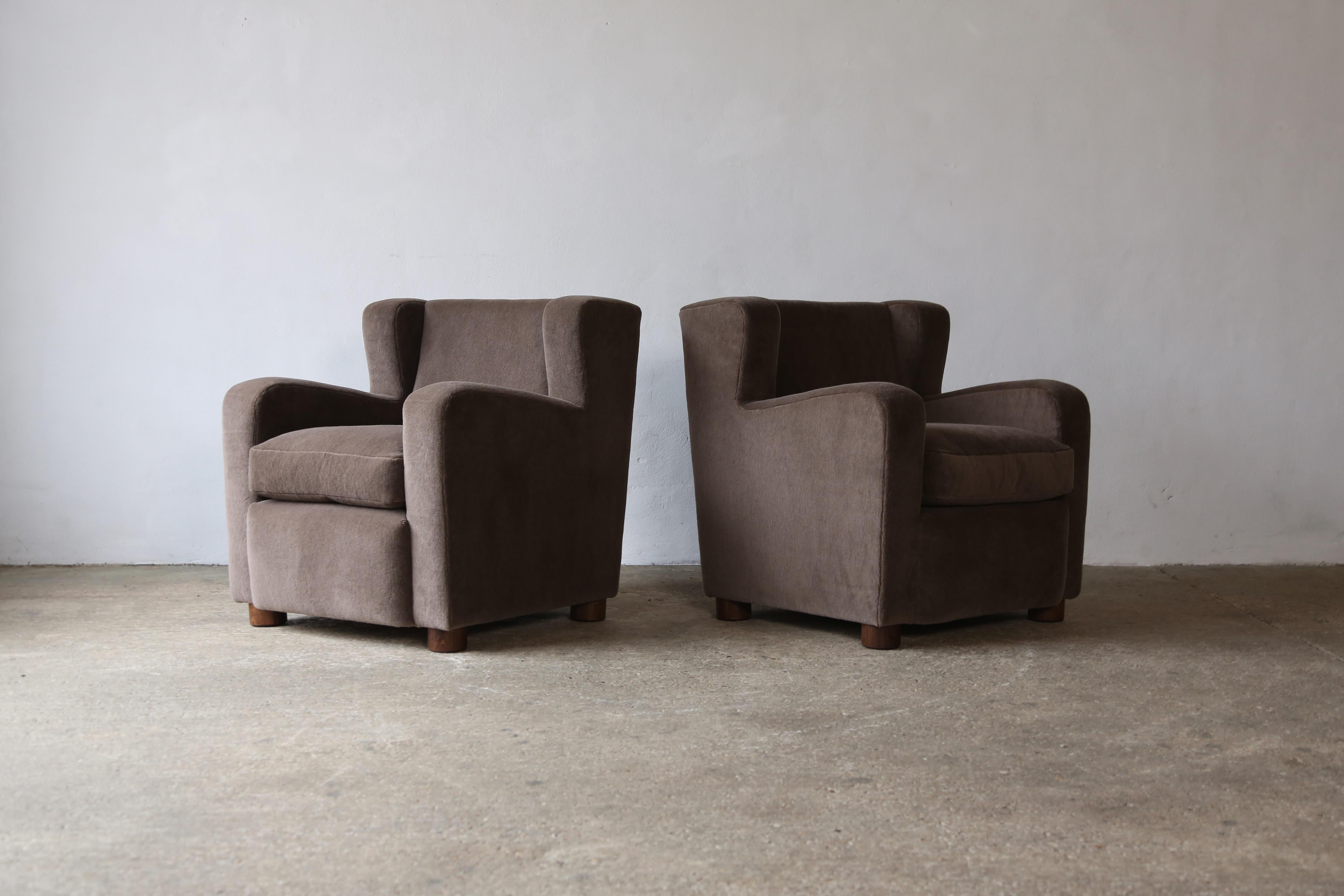 A superb pair of modern armchairs.  Newly upholstered in a premium, soft, pure Alpaca fabric with a feather cushion and solid oak feet.   Also available in COM.  Handmade in England.  Fast shipping worldwide.


