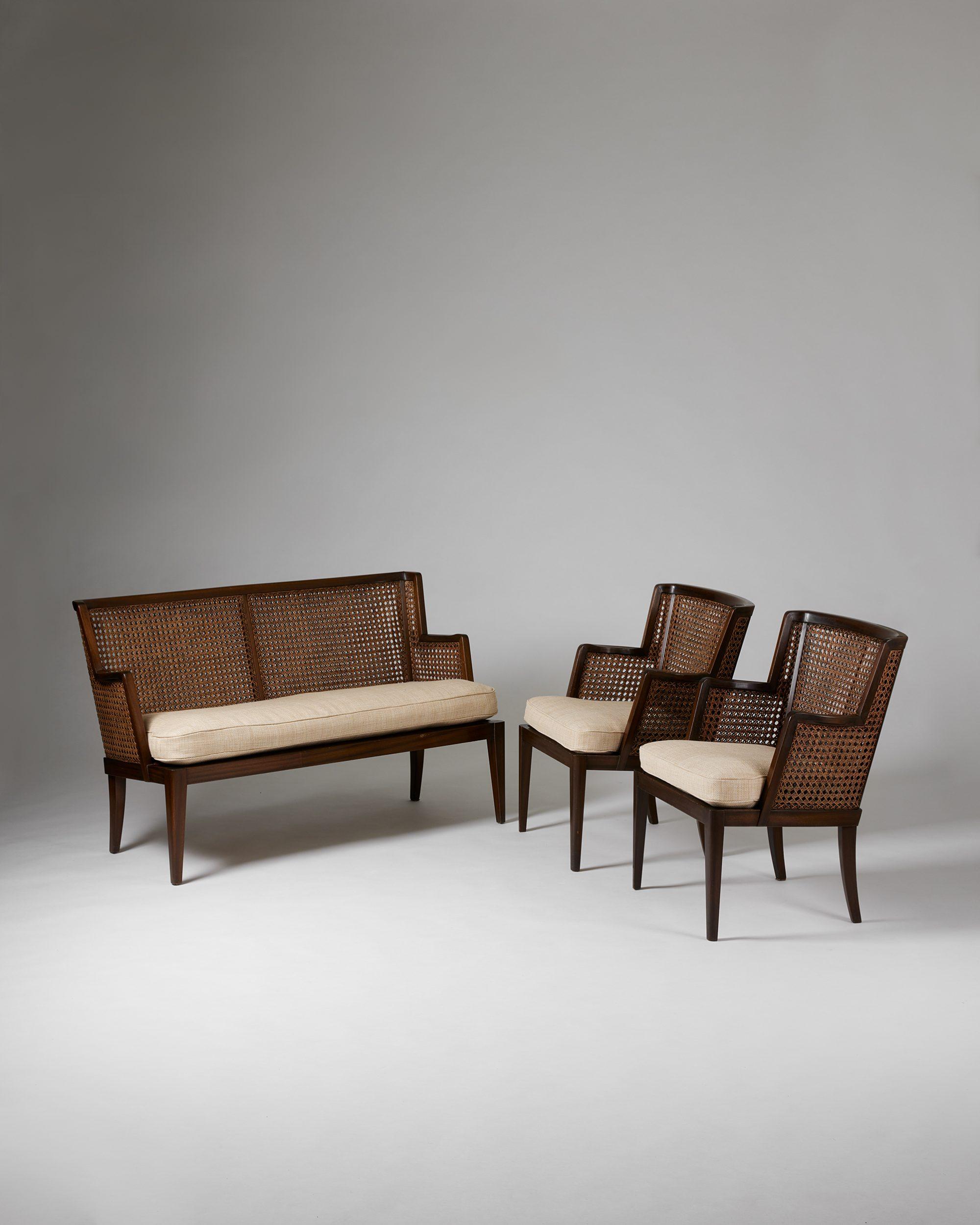 A pair of armchairs and sofa, anoynmous for Paul Boman,
Finland, 1930s.

Stained birch and rattan, upholstered cushions.

Dimensions of the chairs:
H: 79 cm / 2' 7 1/4''
W: 60 cm / 23 3/4''
D: 65.5 cm / 2' 1 3/4''
SH: 43 cm / 17''

Dimensions of the