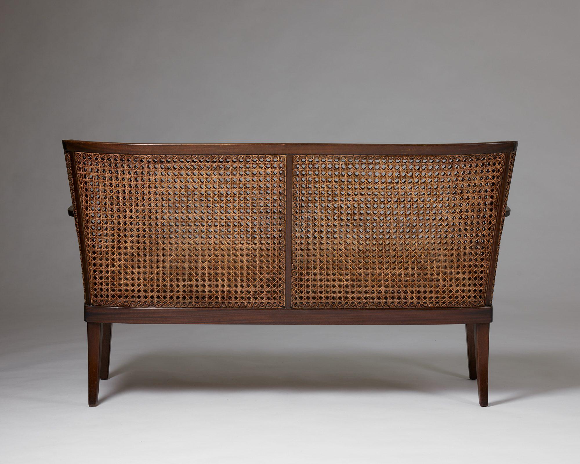 A pair of armchairs and sofa, anoynmous for Paul Boman, Finland, 1930s, rattan For Sale 1