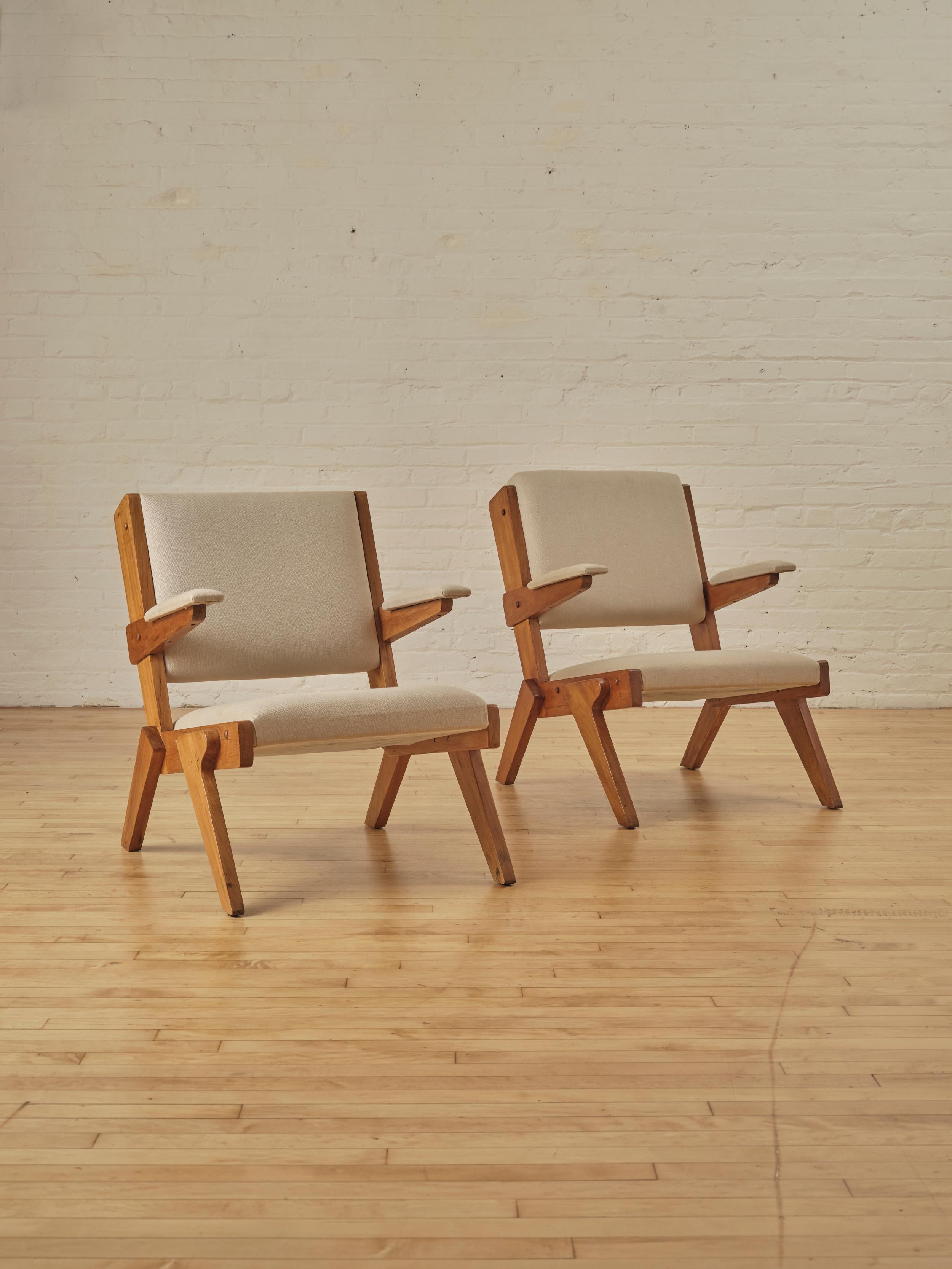 A Pair of Armchairs by Lina Bo Bardi represent a modern Brazilian interpretation of European modern design, with clean lines, sleek curves, and a minimalist yet functional form. 

Each chair in this pair has a slight differences in the wood grain,