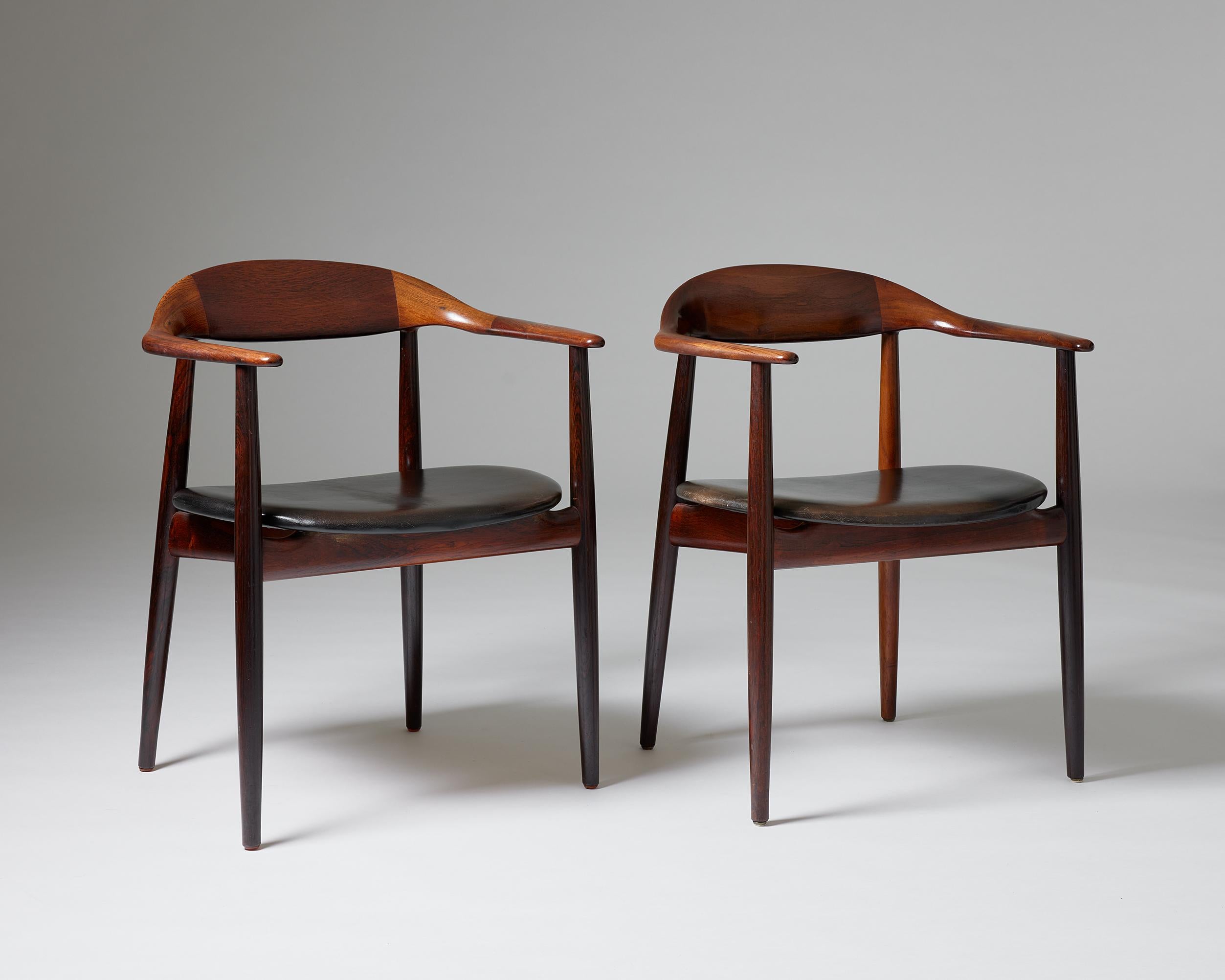 A pair of armchairs designed by Kurt Östervig for Brande Möbelindustri,
Denmark, 1960s.

Rosewood and leather.

Dimensions:
H: 75 cm / 2' 5 1/2''
W: 65 cm / 2' 1 1/2''
D: 51 cm / 20''
SH: 44.5 cm / 17 1/2''
AH: 67.5 cm / 2' 2 1/2''

Literature: