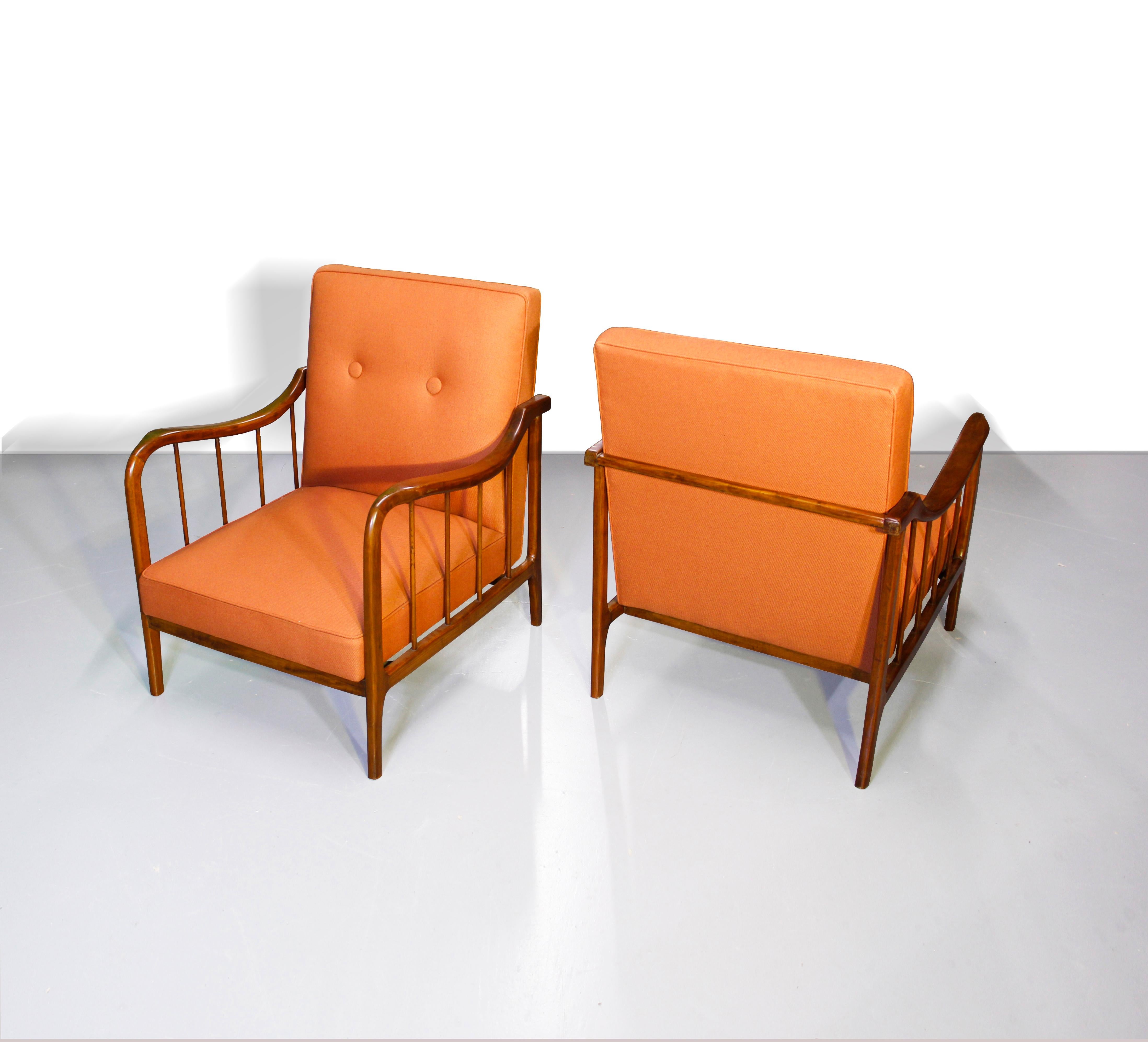 A pair of armchairs made of Caviúna. 
Designed by Rino Levi, Brazil, 1950s

The grain & colour of the wood, plus the impeccable woodwork alone, make these quite impressive armchairs
The sculpted and curvaceous lines of the armrests are beautifully