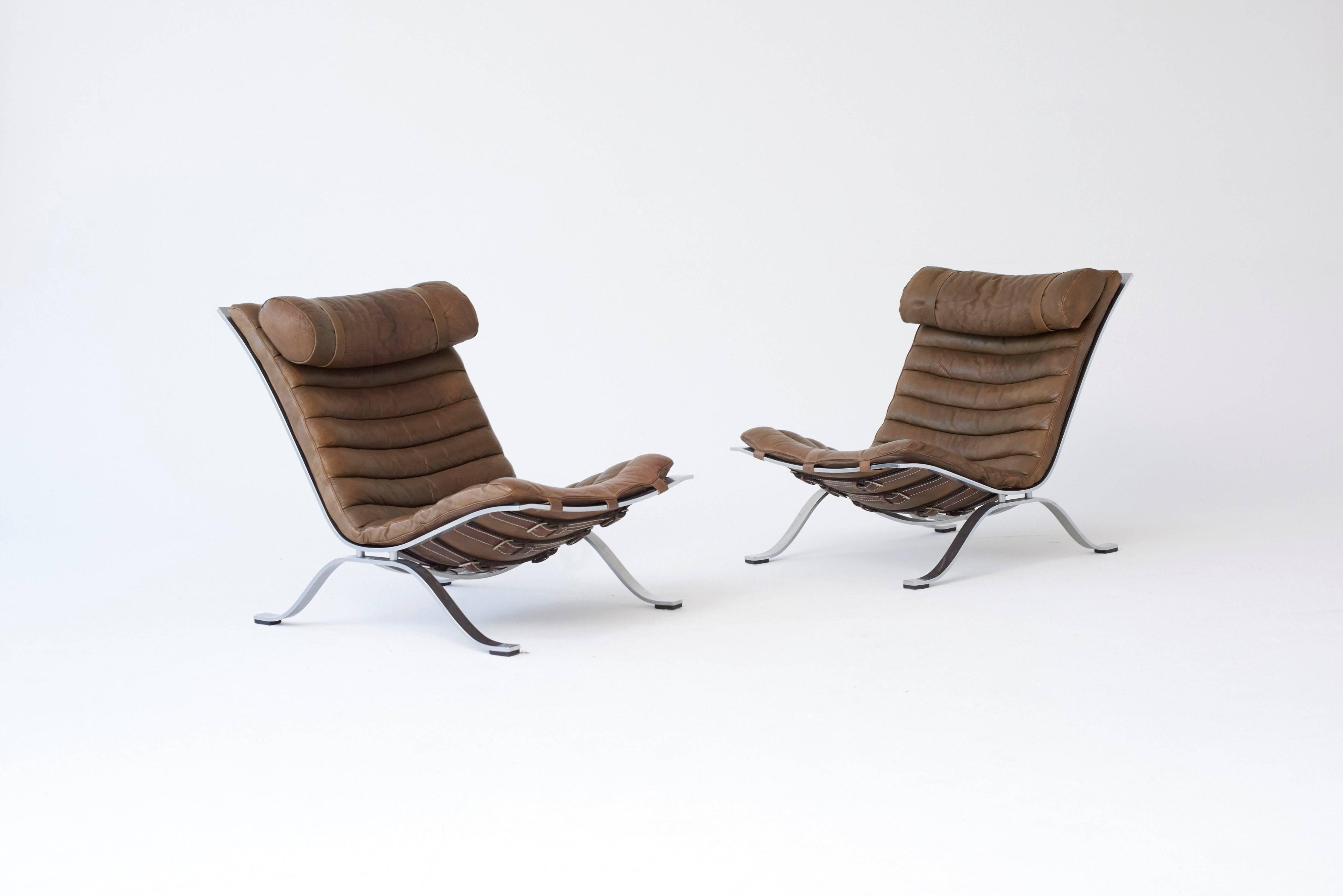 A stunning pair of Arne Norell Ari Chairs, Norell Mobler, Sweden, 1970s. Brown (with a hint of khaki) buffalo leather. Excellent original condition.