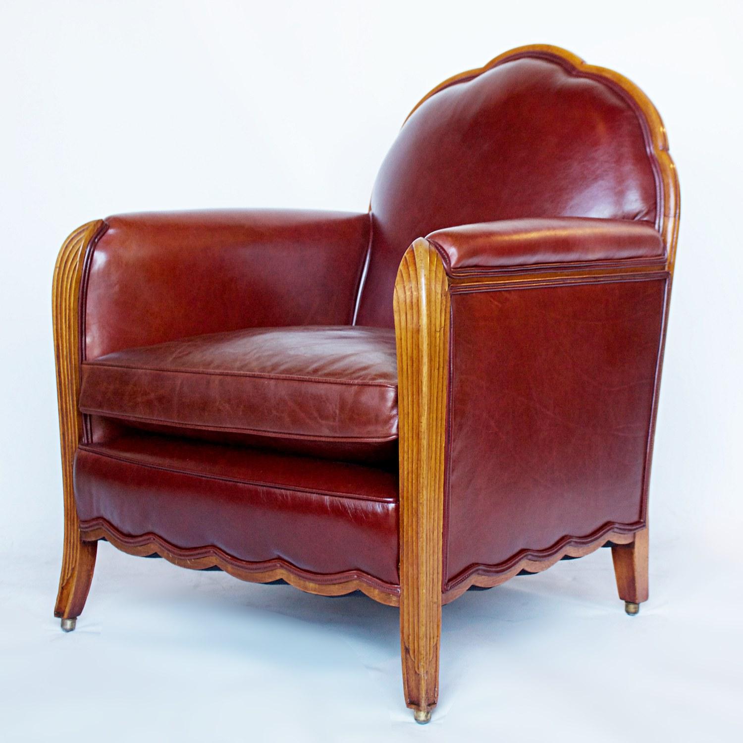 A pair of Art Deco armchairs. Fluted legs with bevelled detailed frame. Solid walnut throughout. Re-upholstered in chestnut leather. 

Dimensions: H 89cm W 72cm D 72cm Seat H 43cm W 50cm D 50cm

Origin: French

Date, circa 1925

Item Number: