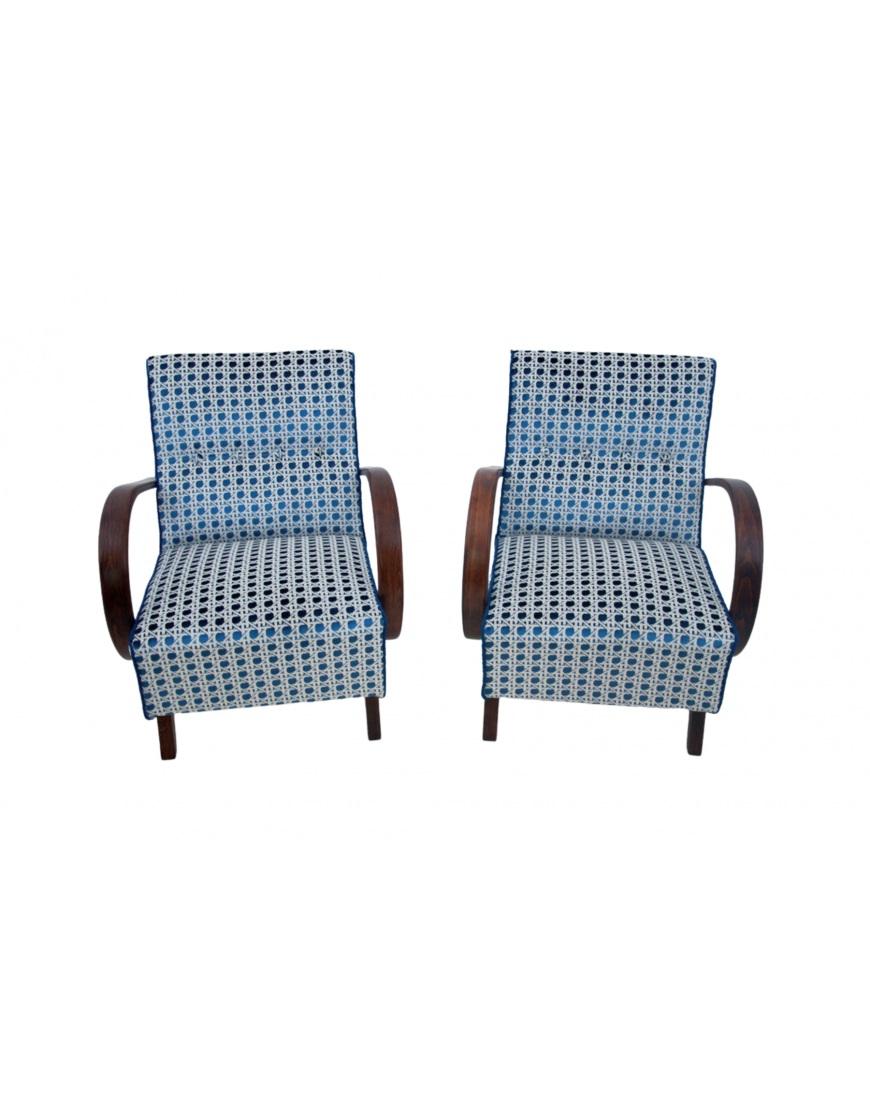 Iconic armchairs designed by J.Halabala in the Art Deco style, made around 1930. Seats and backrests upholstered in blue and white fabric. The whole rests on straight legs, and the bent wooden armrests add chic. Very comfortable armchairs, which,