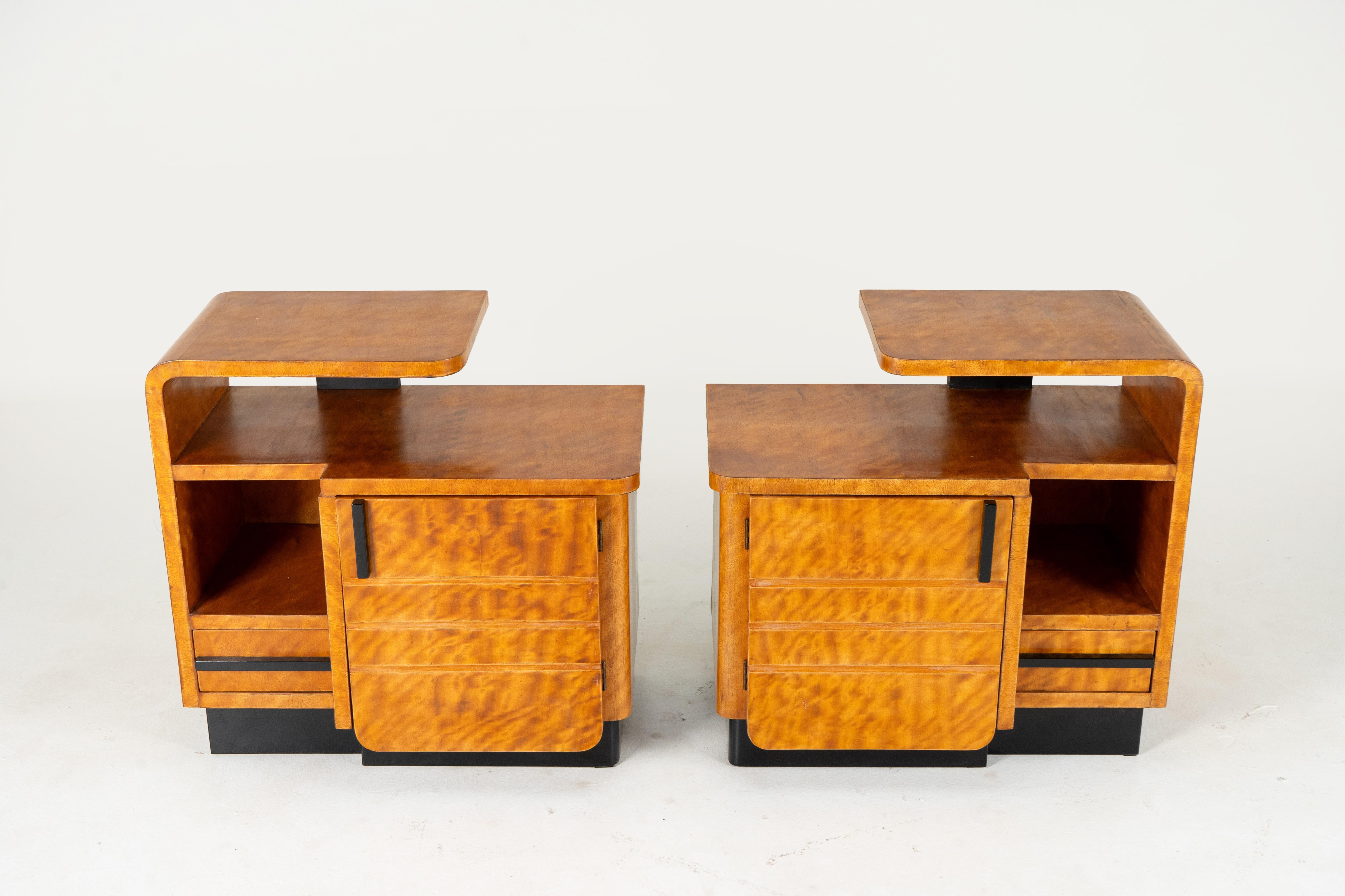 These Art Moderne bedside chests date to the 1930's and were made in Czechoslovakia.  The Czechs and the Hungarians embraced very modern Art Deco styles in the interwar years.    The Art Moderne variant of Art Deco was particularly popular because