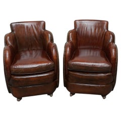 A Pair of Art Deco Brown Leather Cloud Armchairs