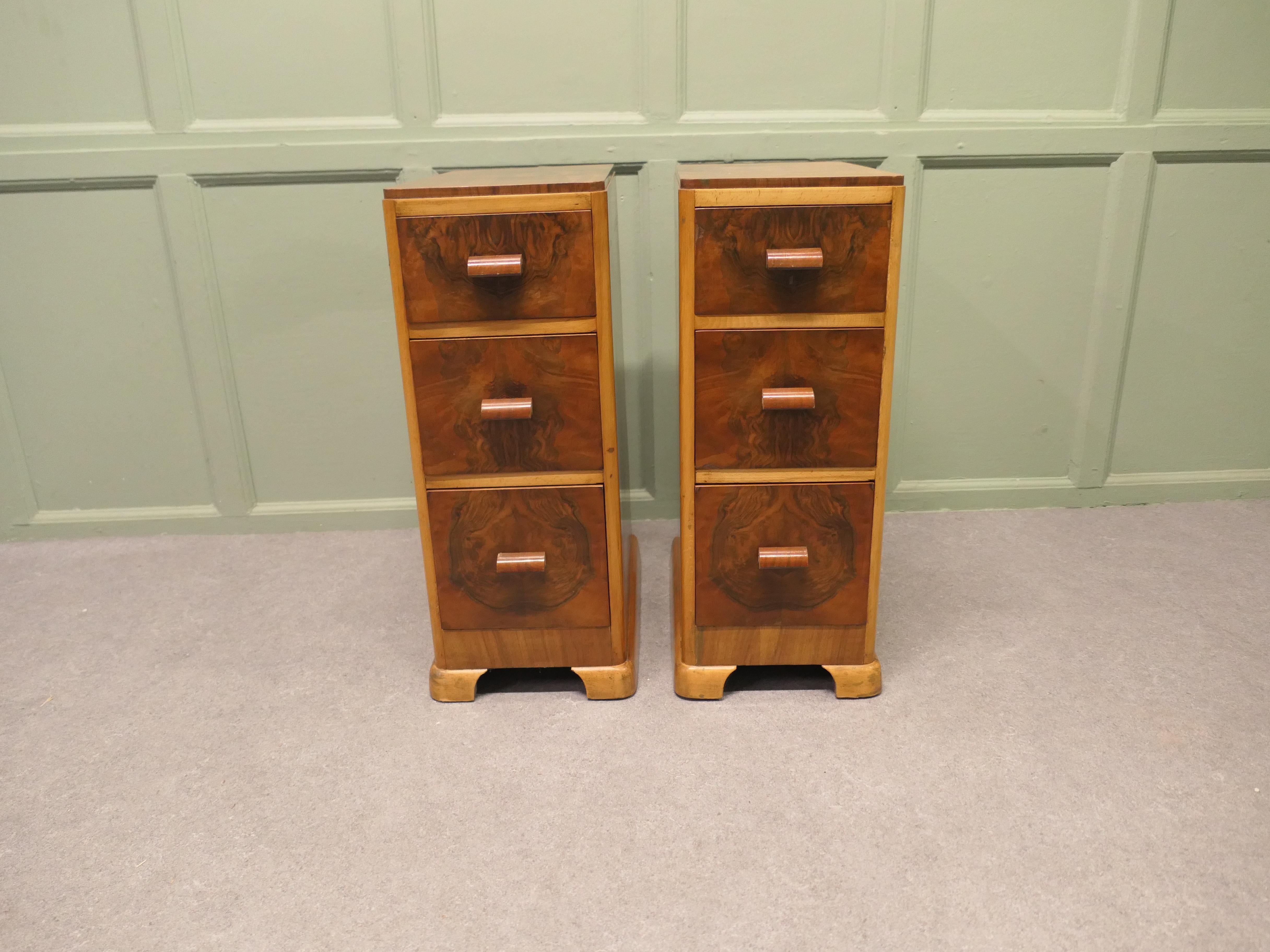 
A Pair of Art Deco Burr Walnut Bedside Chest of Drawers

These elegant chests are made with superbly figured walnut they each have 3 drawers  
The drawers run very smoothly they have wooden handles, and they stand on small feet. 
The chests are