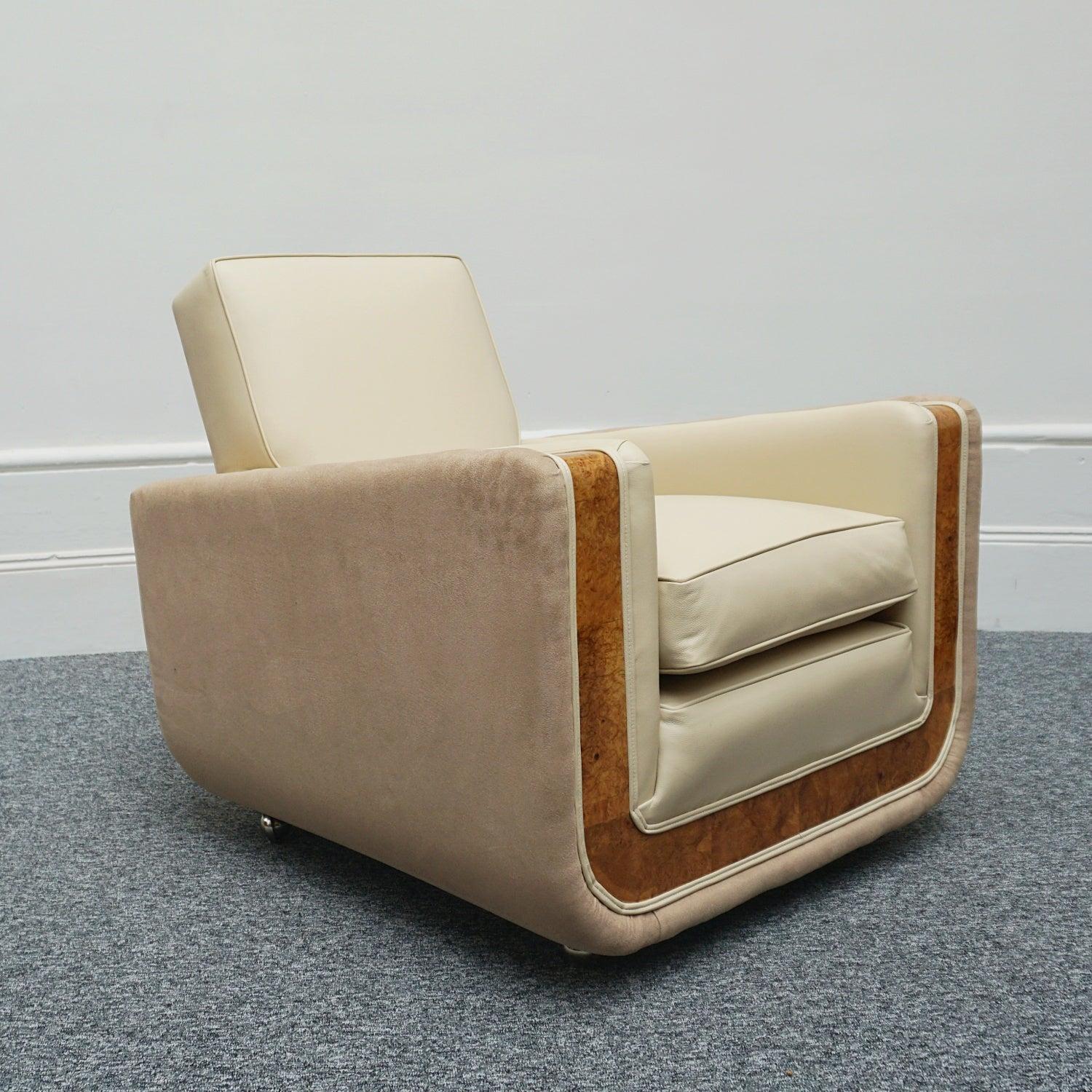 A pair of Art Deco 'Tank Chairs'. Burr walnut veneered U-shaped banding. Re-upholstered in cream leather and contrasting faux-suede to sides and back. 

Dimensions: H 78cm W 85cm D 82cm Seat H 47cm 

Origin: English

Date: Circa 1935

Item