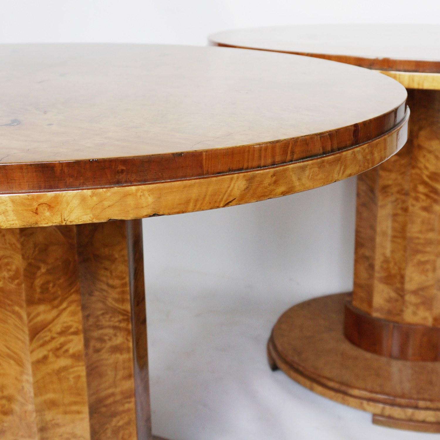 A pair of Art Deco centre tables by Harry & Lou Epstein. Veneered walnut oval tables with fluted central columns and oval, stepped bases. Elm banding to bottom of stem.

Dimensions: H 75cm, W 91cm, D 73cm

Origin: English

Date: circa