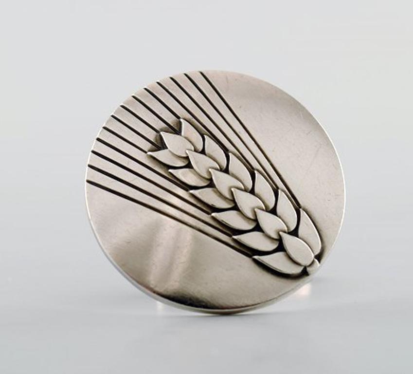 A pair of art deco cufflinks in silver by Georg Jensen. Design number 78A. Ear of wheat. 
Stamped.
In very good condition.
Diameter: 3 cm.