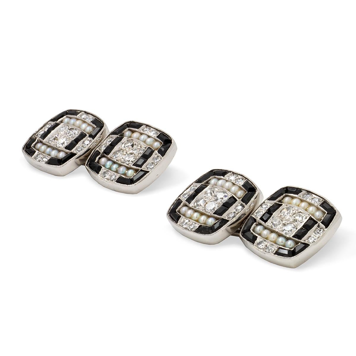 A pair of Art-Deco diamond, pearl and onyx cufflinks, each face set with swiss-cut diamonds, onyx and natural pearls in a geometric design, all set in platinum to a chain link, circa 1920, each plaque measuring approximately 1.3 x 1.3cm, gross