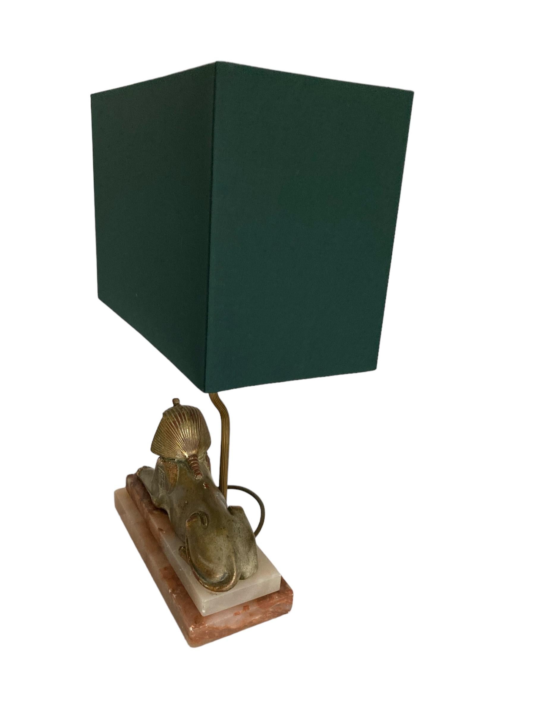 A Pair of Art Deco Egytian Sphinx Table Lamps on a Marble Base Dark Green Shades In Good Condition In Bishop's Stortford, GB