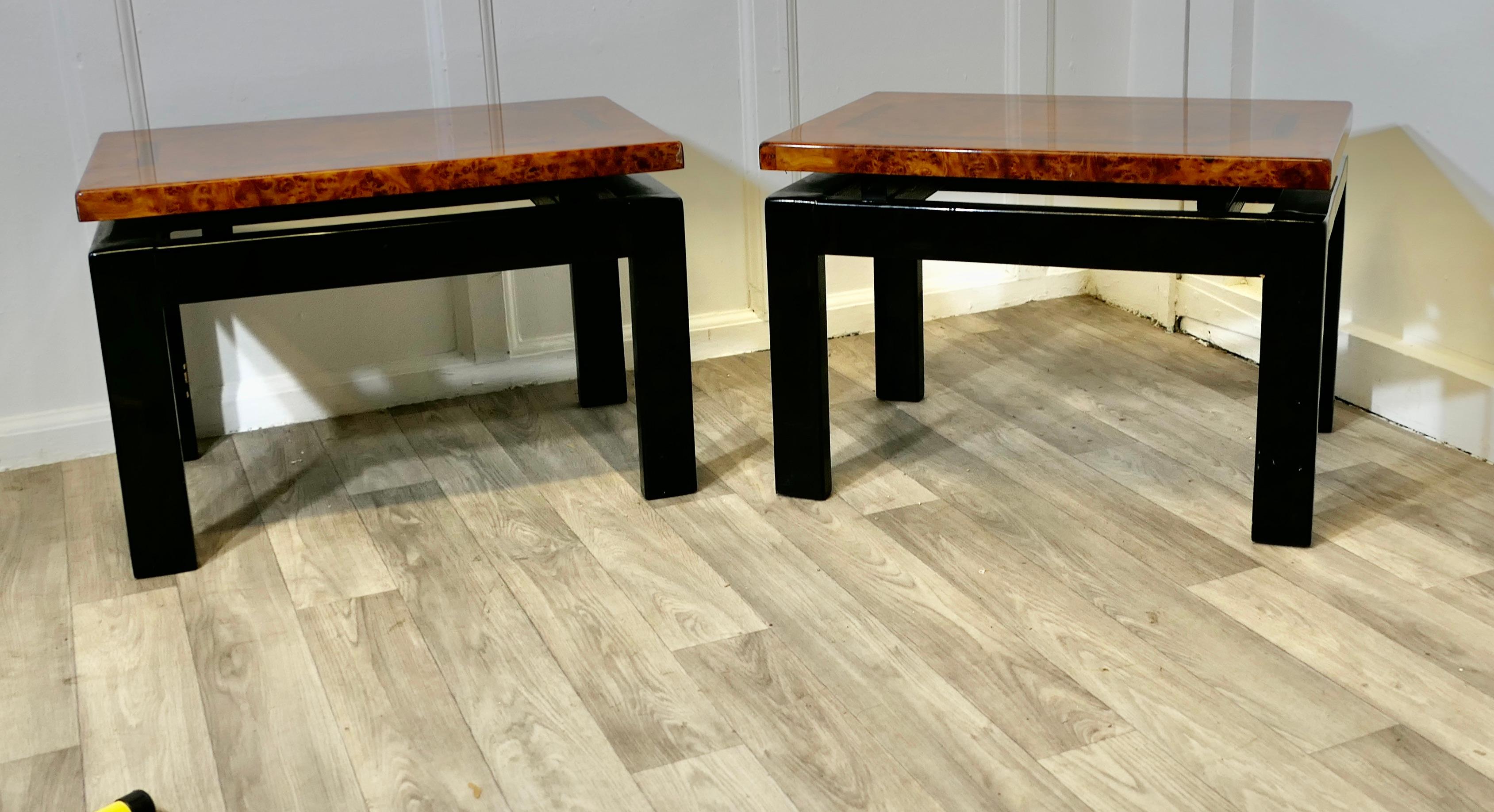 A Pair of Art Deco Floating Top Walnut & Lacquered Low Tables

A Pair of Art Deco Floating Top Burr Walnut & Black Lacquered Low Tables
A superb pair of sofa or coffee tables, a classic of their time  with square minimalistic design and floating