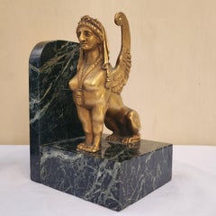 A pair of Art Deco Gilt Bronze and Marble Base Sphinxes Bookends