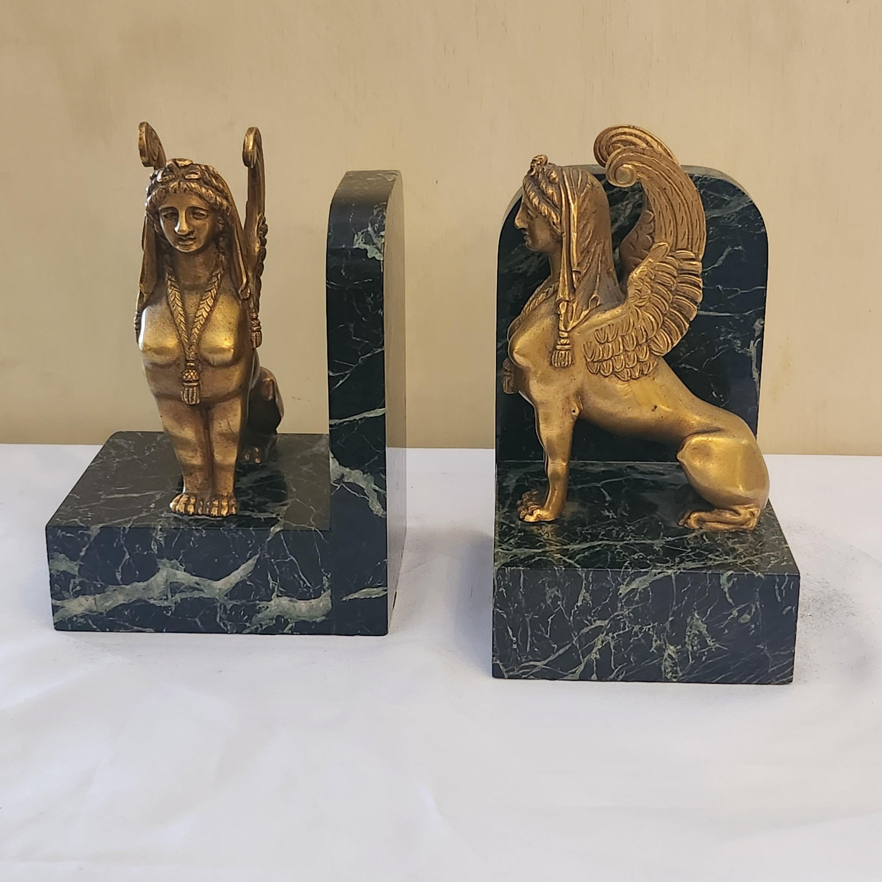 European A pair of Art Deco Gilt Bronze and Marble Base Sphinxes Bookends For Sale