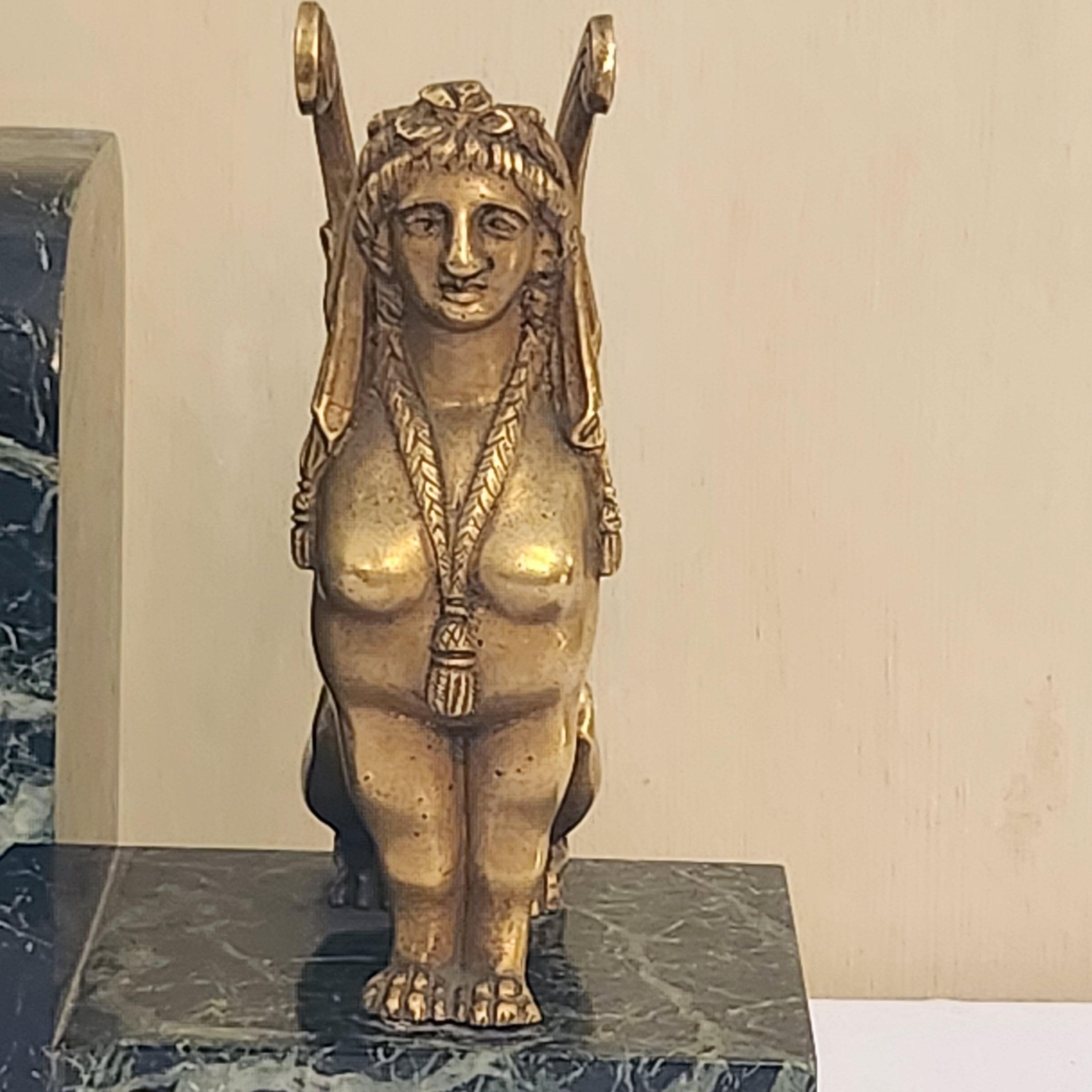 A pair of Art Deco Gilt Bronze and Marble Base Sphinxes Bookends In Good Condition For Sale In CABA, AR