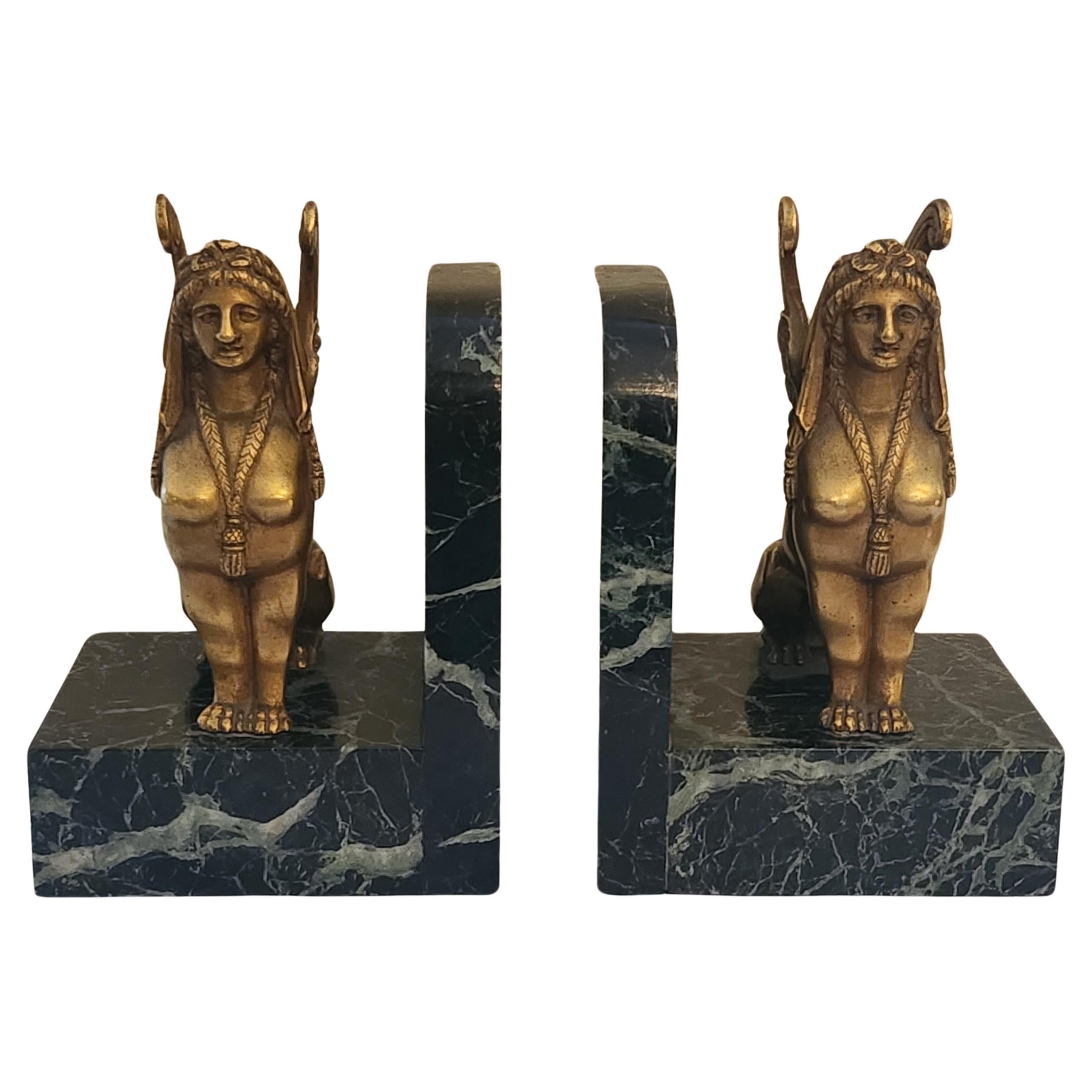 Paire de serre-livres Sphinx en bronze doré et base en marbre Art Déco