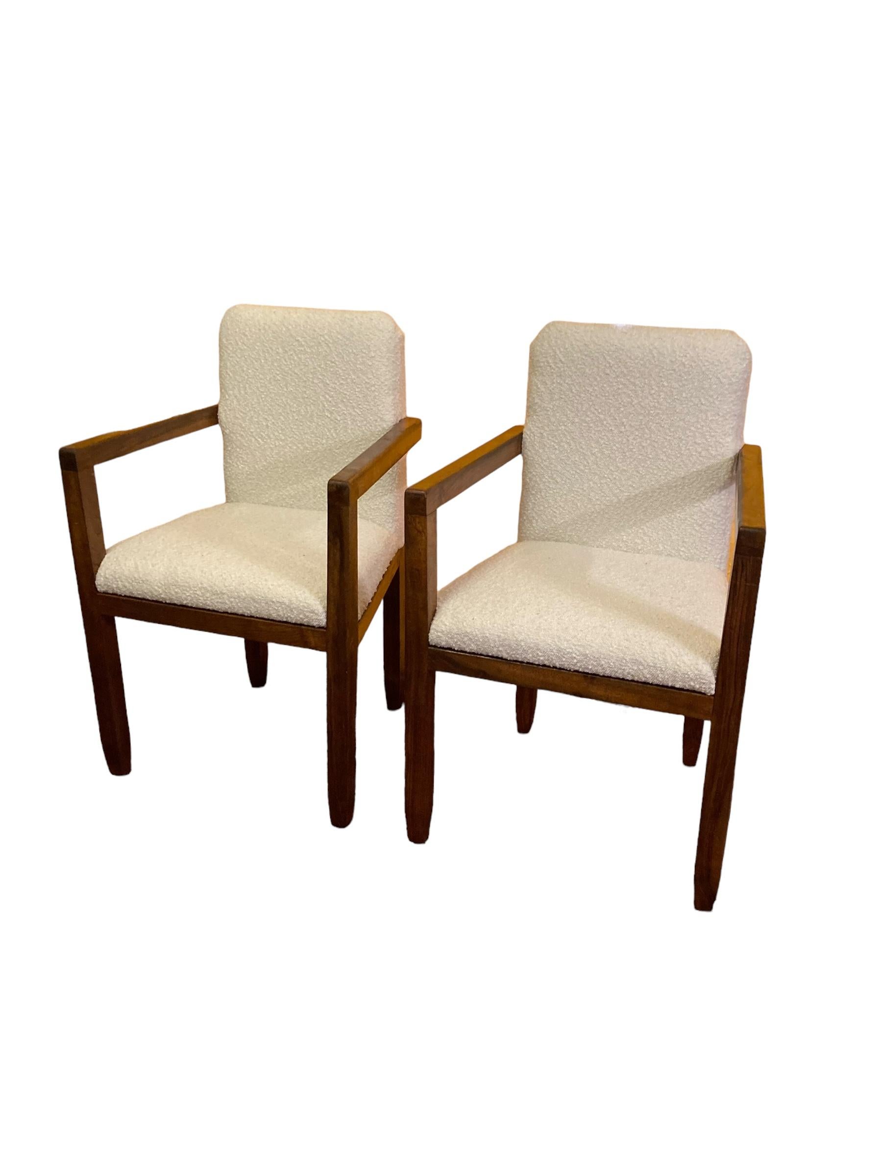 A Pair of Art Deco Mahogany framed Armchairs, White Boucle Upholstery 1920's. Hand made and solid construction. These chairs are both rare and unusual.  They show a completely unique design that fits in to any style of interior design. Art Deco