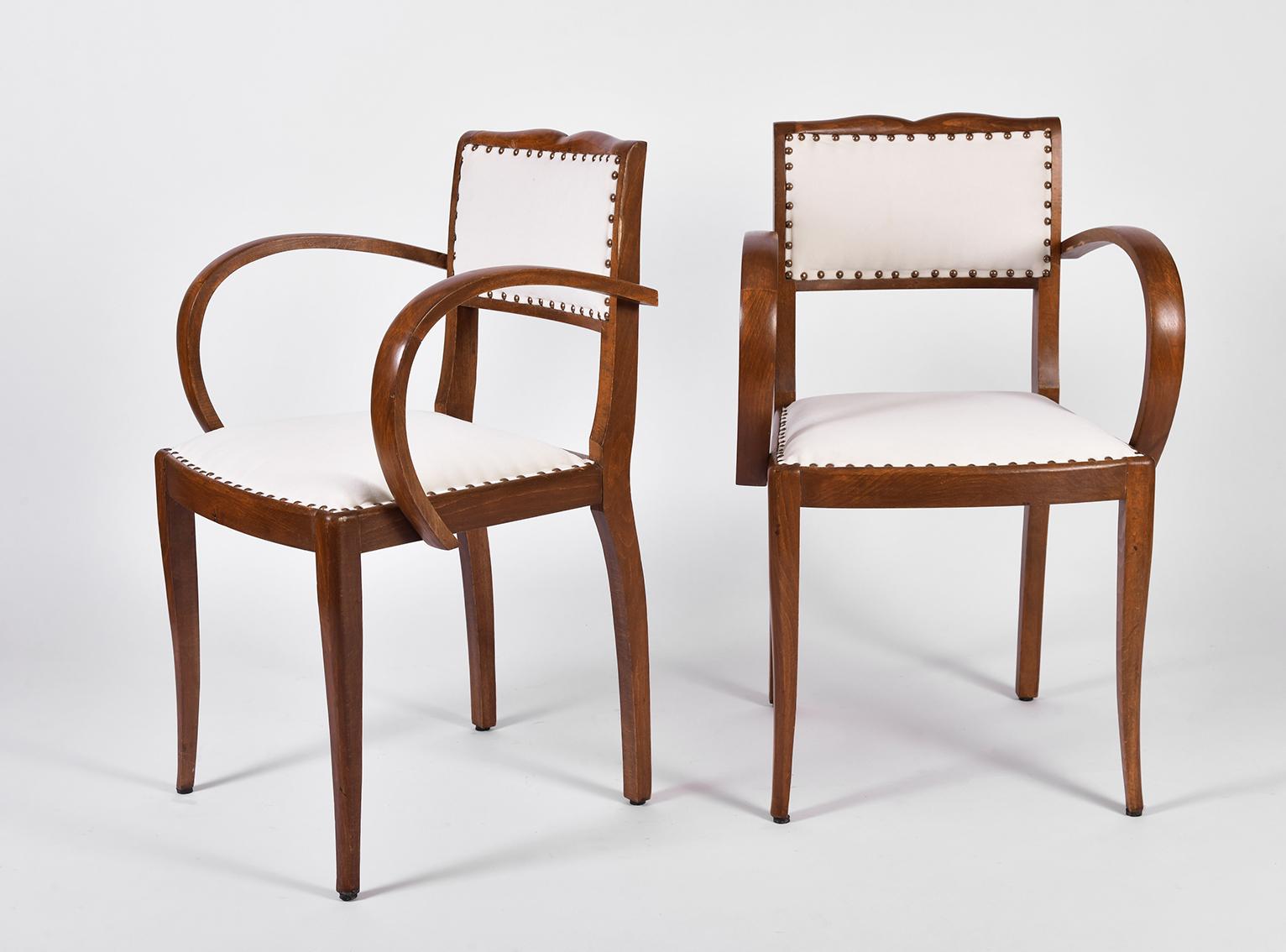 A pair of Art Deco oak chairs
Upholstered in off-white velvet
France, circa 1920.