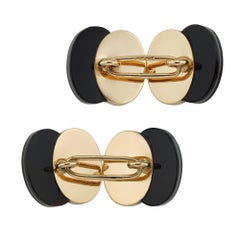A pair of Art Deco onyx and pearl gold cufflinks
