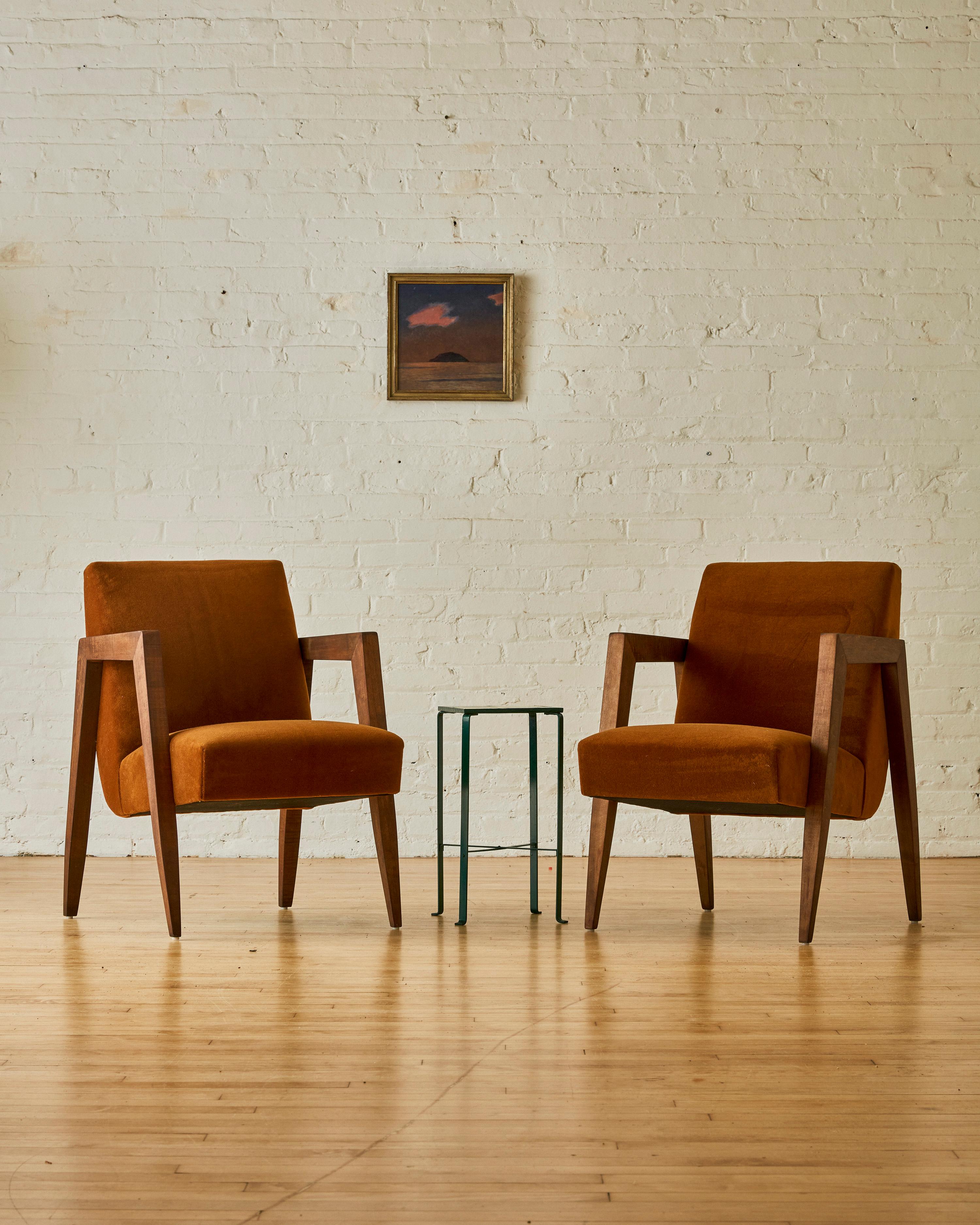 A pair of Art Deco parlor armchairs reupholstered in mohair with a teak wood frame.

