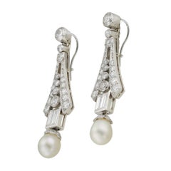 A pair of Art Deco pearl and diamond drop earrings