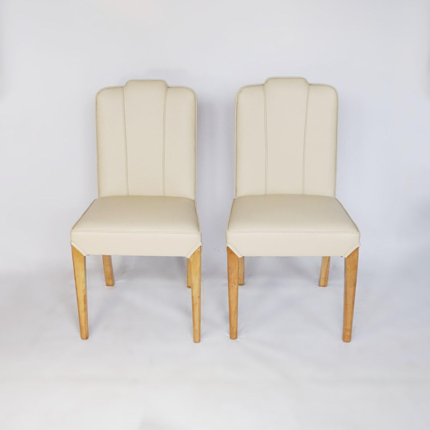 A pair of Art Deco side chairs. Burr walnut veneered backs, re-upholstered in cream leather. 

Dimensions: H 96cm, W 43cm, D 44cm, seat H 48cm, D 41cm

Origin: English

Date: circa 1930

Item number: 902216

All of our furniture is