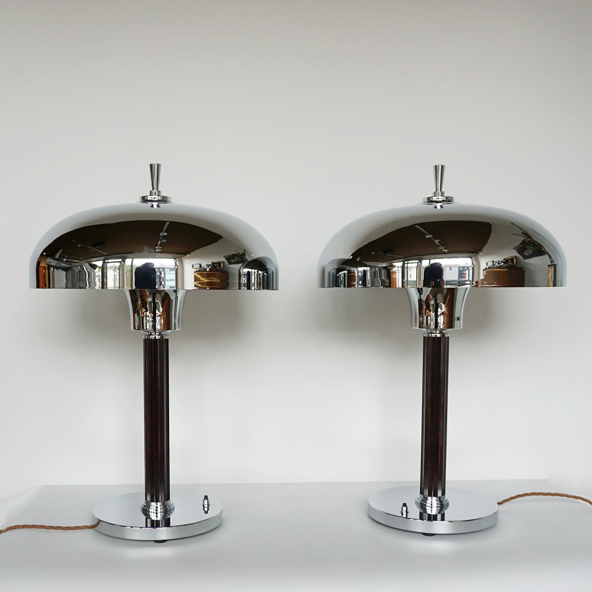 A pair of Art Deco dome lamps. Fluted brown bakelite stems with chrome metal dome shades.

Dimensions: H 55cm D (of Shade) 37cm

Origin: English

Item Number: J342

All of our lighting is fully refurbished, re-wired, and re-chromed with some