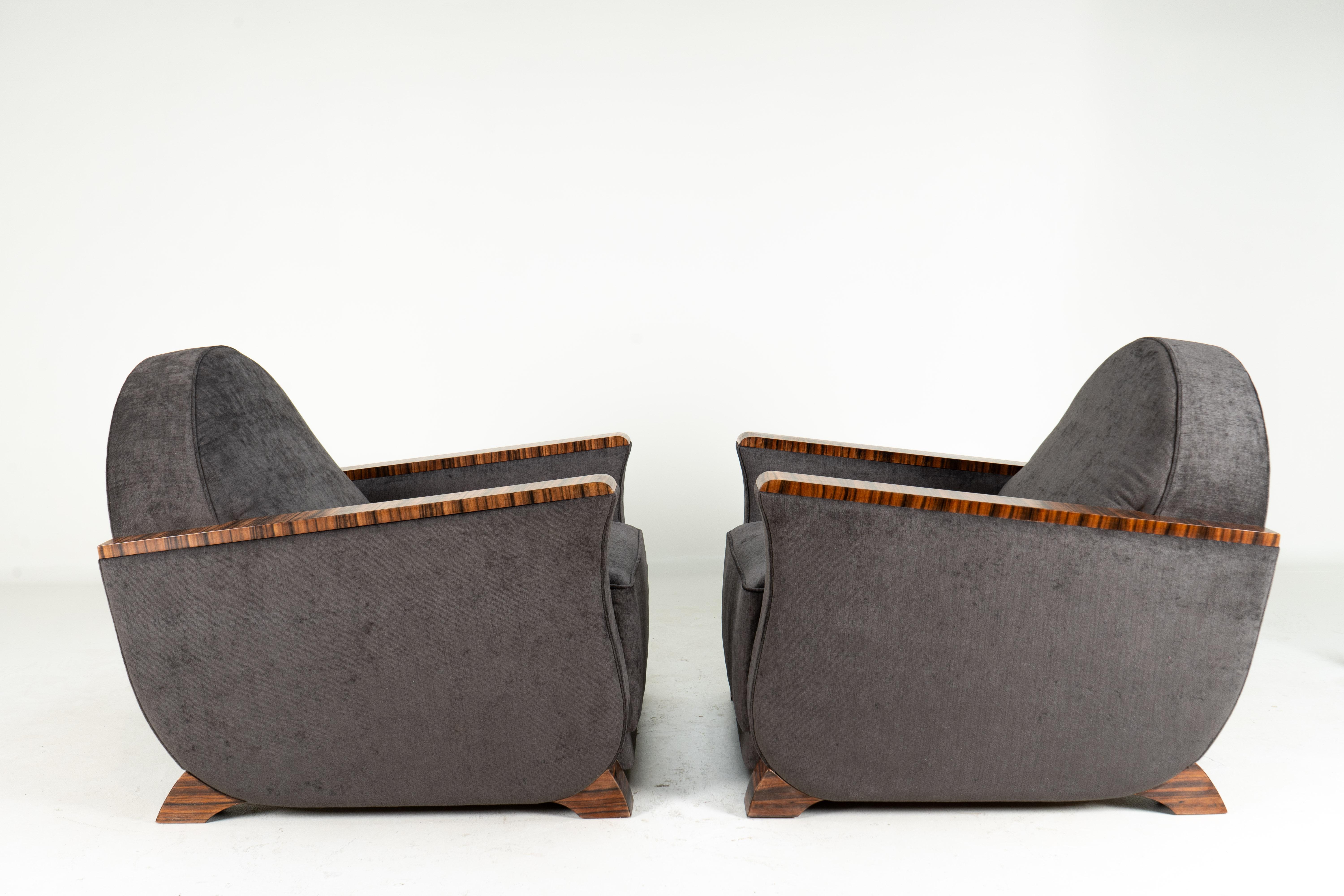 These sculptural and softly voluminous armchairs are modern copies of 1930's Hungarian originals. Though French Art Deco is more famous, Budapest, Hungary was a center of Art Deco design during the interwar period. Experience gained during the