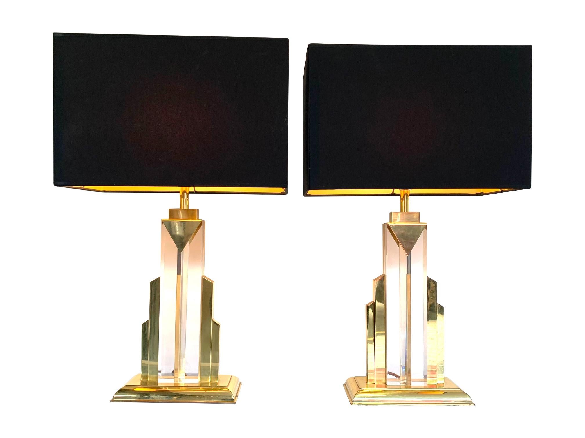 A pair of Art Deco style skyscraper lamps with Lucite centres with brass base and surrounds. With bespoke black shades with gold linings. Re wired with antique gold cord flex and PAT tested.
