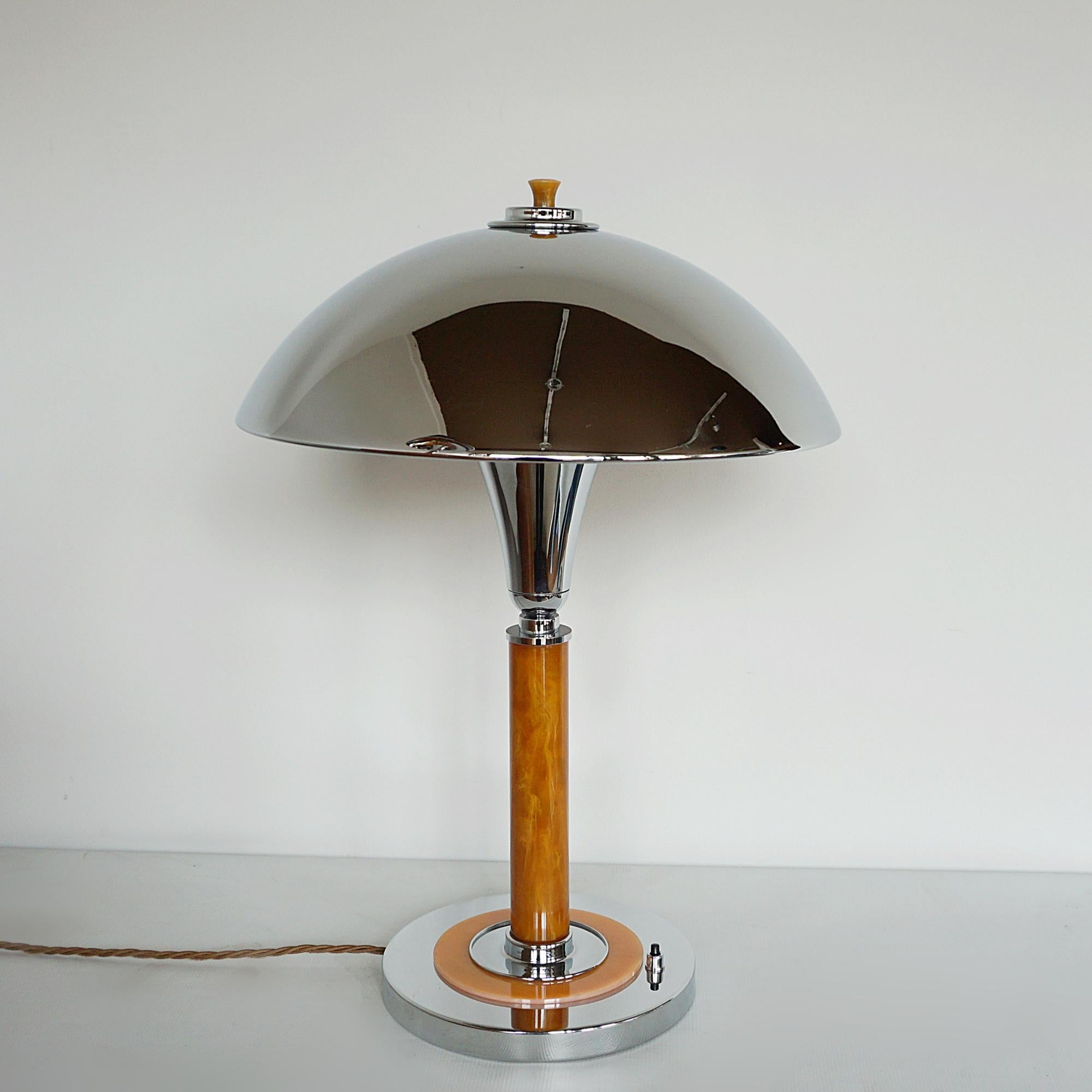 English A Pair of Art Deco Style Orange Bakelite and Chrome Dome Table Lamps