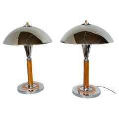 A Pair of Art Deco Style Orange Bakelite and Chrome Dome Table Lamps