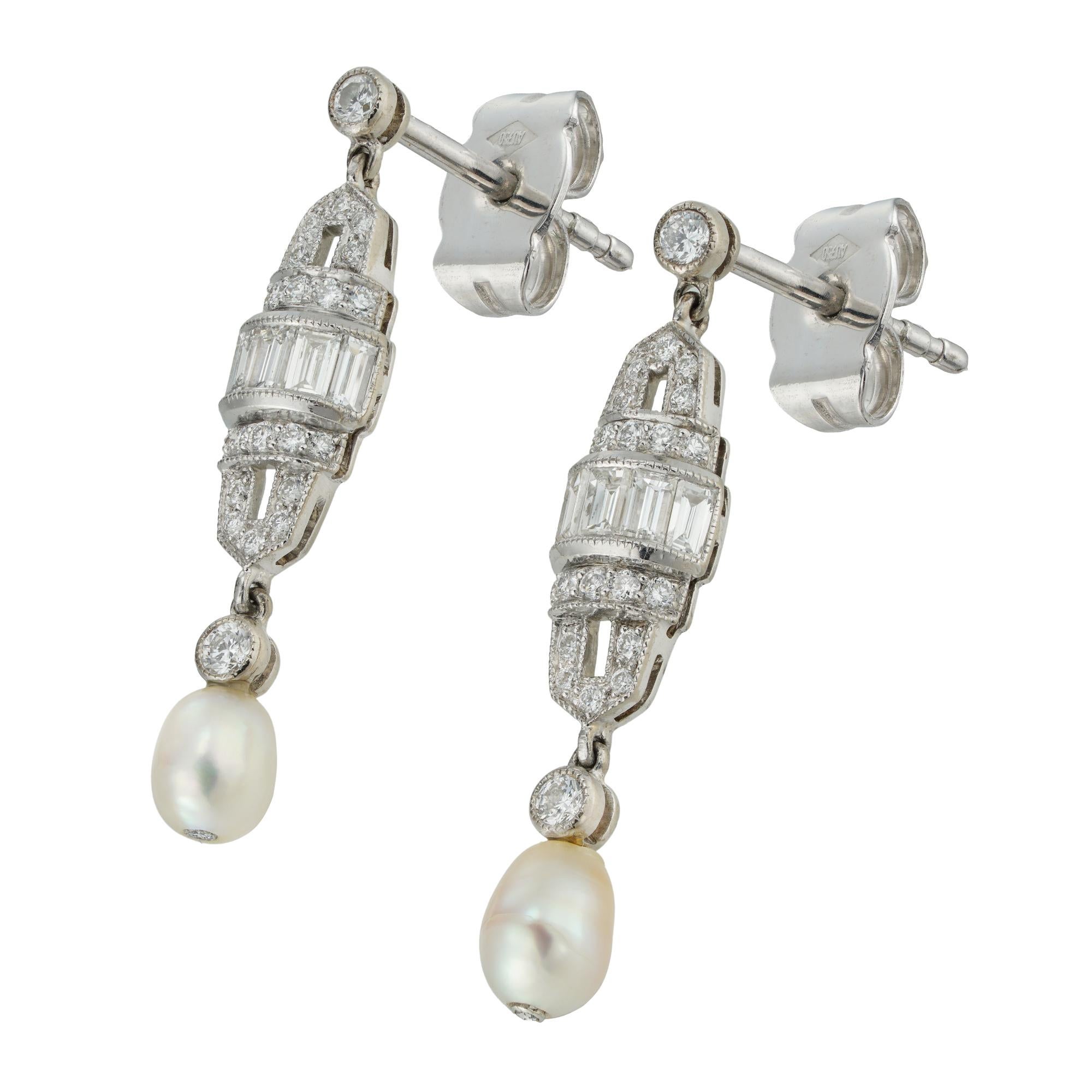 A pair of Art Deco style pearl and diamond drop earrings, each earring with a barrel-shaped openwork diamond-set plaque, centrally set with a line of baguette-cut diamonds within circular-cut diamond-set borders, suspended from a single diamond and