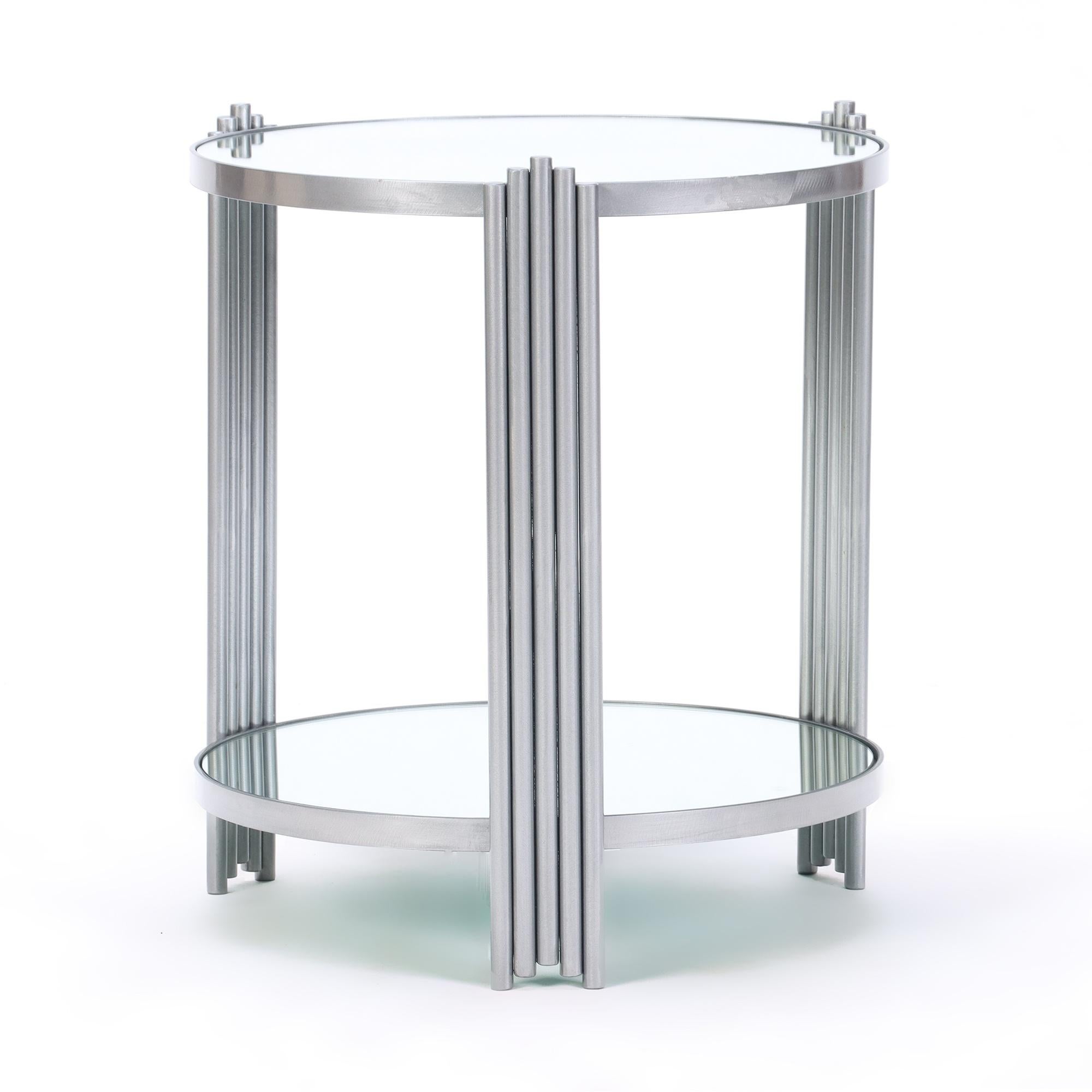 An elegant and stylish pair of Art Deco style round end tables with mirrored tops. Contemporary.