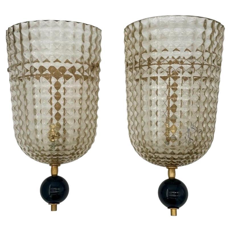A pair of Art Deco style smoked Murano glass and brass wall sconces For Sale