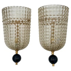 A pair of Art Deco style smoked Murano glass and brass wall sconces