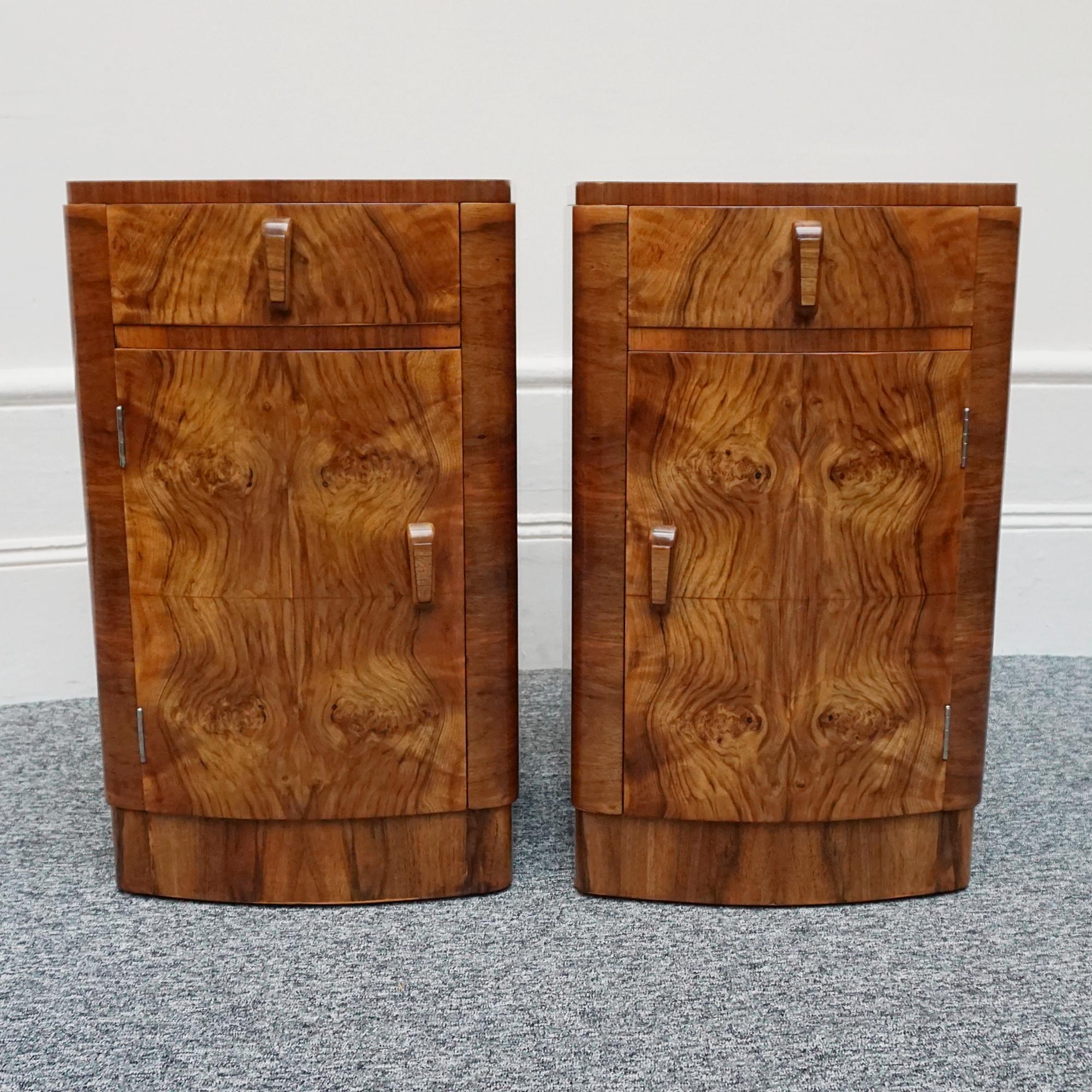A pair of Art Deco, bedside cabinets in figured walnut with original wooden handles. Drawer to top with shelved cabinet beneath.

Dimensions: H 66cm, W 39cm, D 38cm

Origin: English

Date:  circa 1930

Item No: 2102241

All of our furniture is