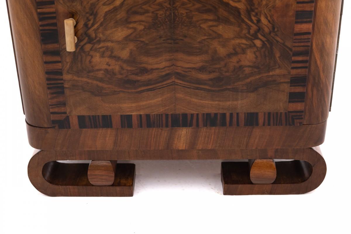 A pair of Art Deco walnut bedside tables. 4